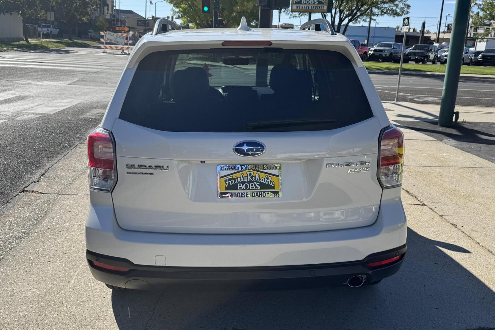 2017 White /Tobacco Subaru Forester Touring (JF2SJAWC7HH) with an H4 2.5 Liter engine, Automatic transmission, located at 2304 W. Main St., Boise, ID, 83702, (208) 342-7777, 43.622105, -116.218658 - Low Mileage And Highly Optioned! Loaded With Safety Features! - Photo#1
