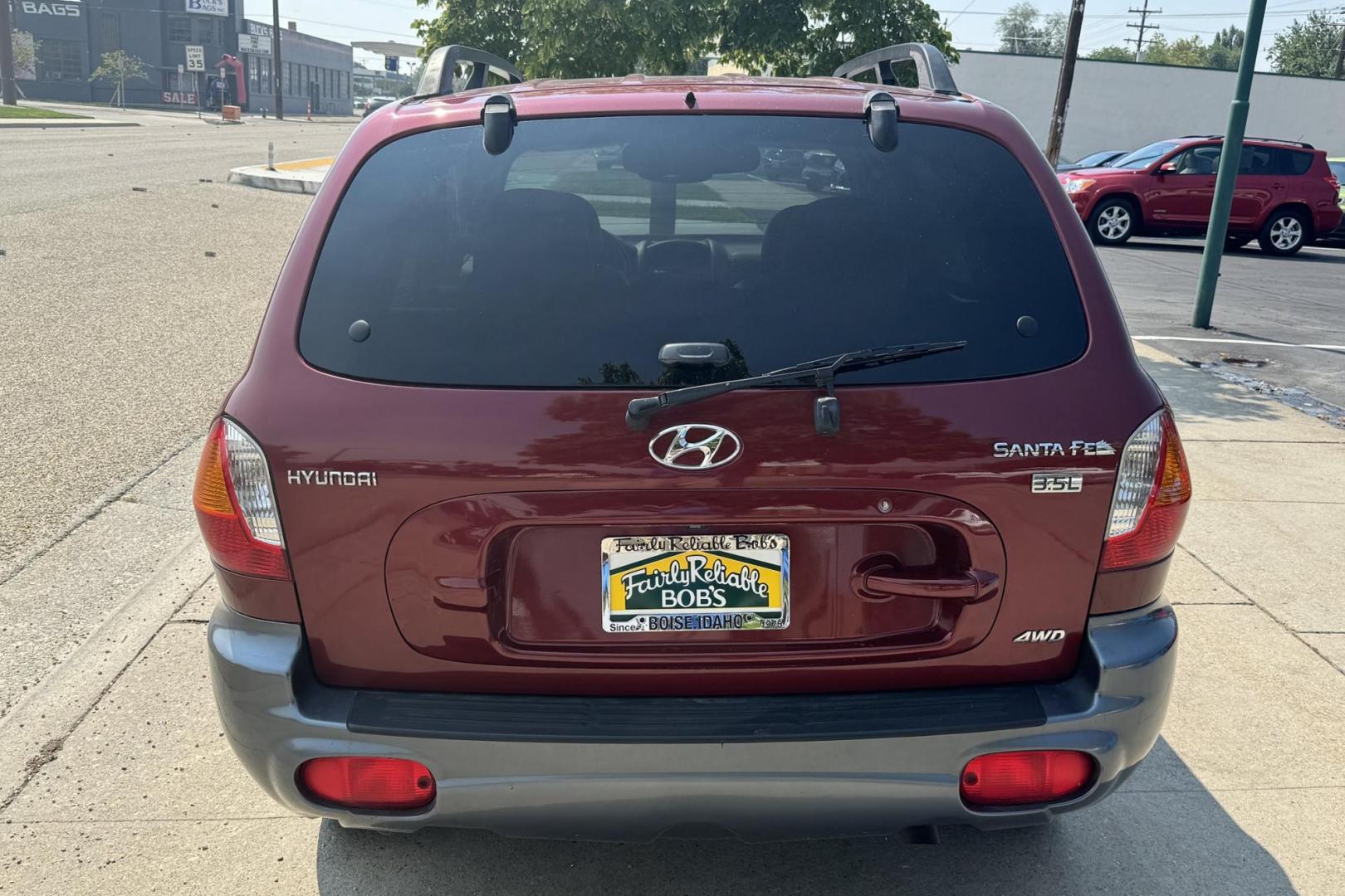 2003 Maroon /Tan Hyundai Santa Fe GLS (KM8SC73EX3U) with an V6 3.5 Liter engine, Automatic 5 Speed transmission, located at 2304 W. Main St., Boise, ID, 83702, (208) 342-7777, 43.622105, -116.218658 - 2003 HYUNDAI - Photo#1