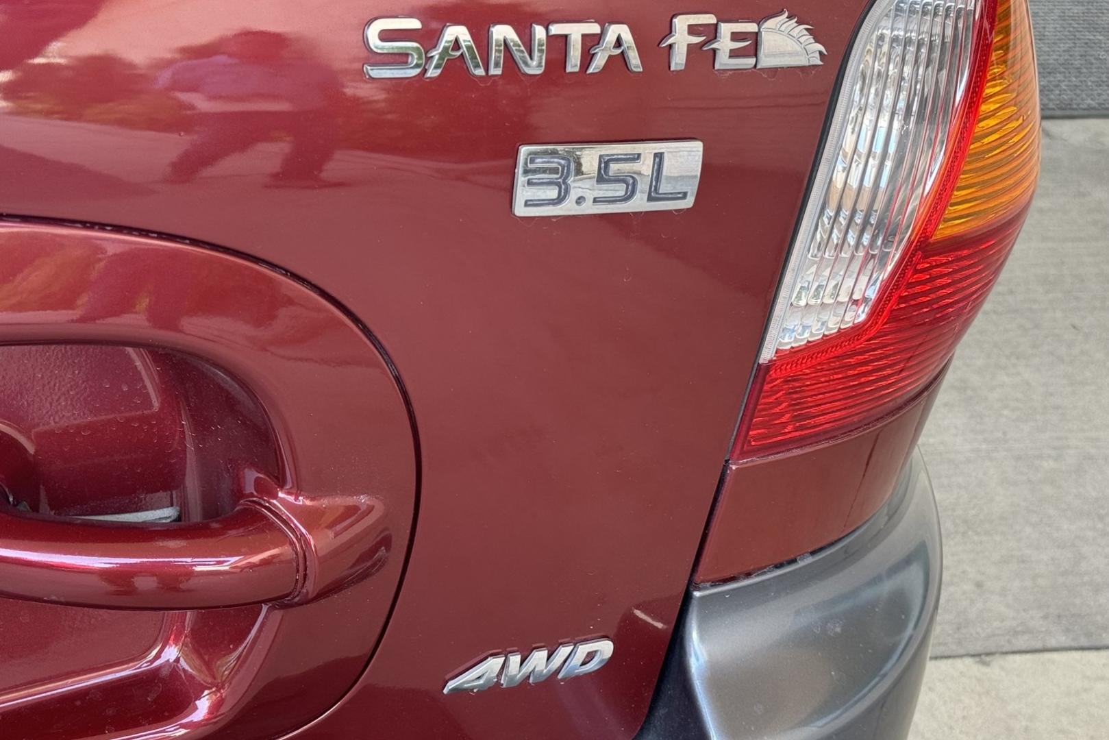 2003 Maroon /Tan Hyundai Santa Fe GLS (KM8SC73EX3U) with an V6 3.5 Liter engine, Automatic 5 Speed transmission, located at 2304 W. Main St., Boise, ID, 83702, (208) 342-7777, 43.622105, -116.218658 - 2003 HYUNDAI - Photo#19