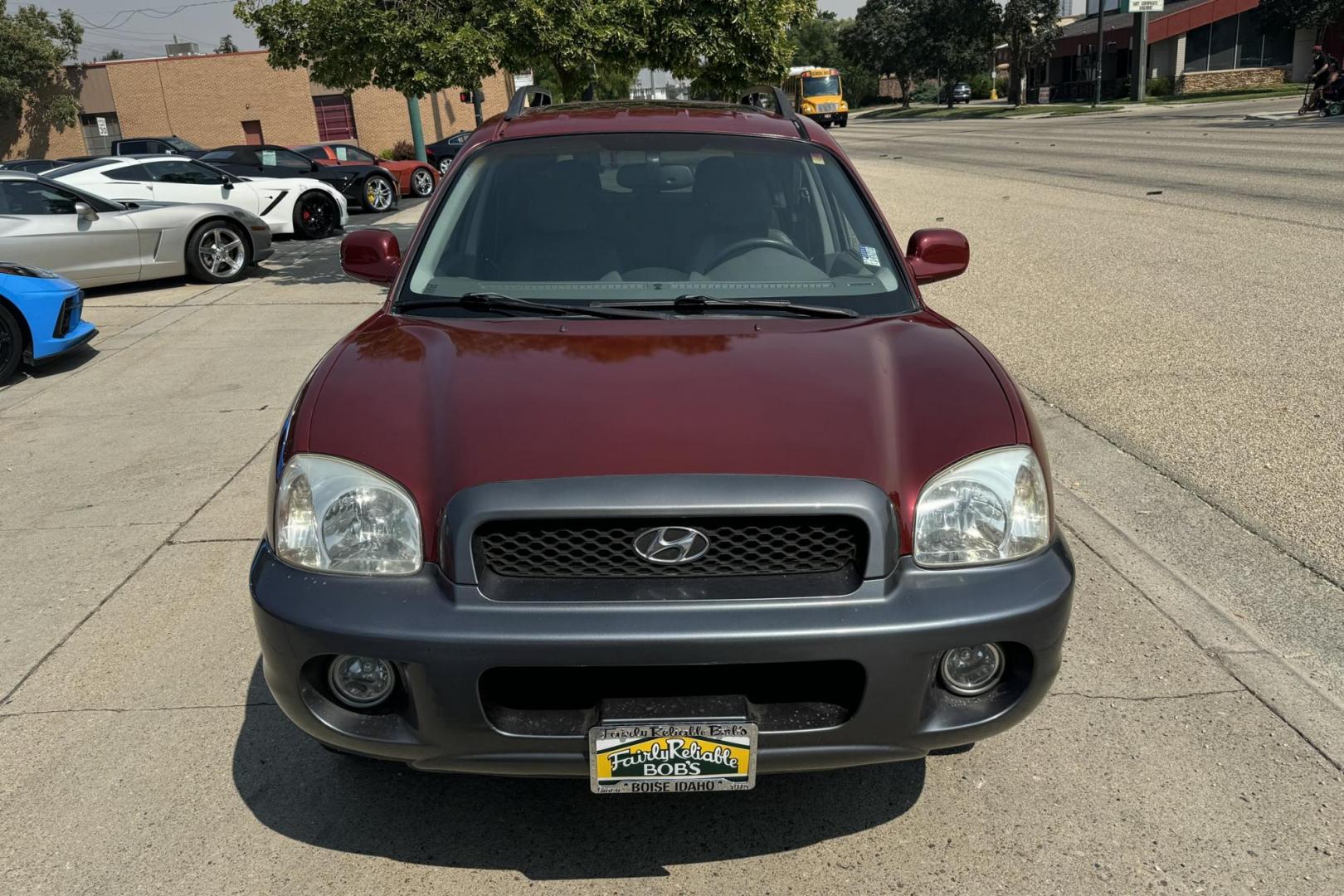 2003 Maroon /Tan Hyundai Santa Fe GLS (KM8SC73EX3U) with an V6 3.5 Liter engine, Automatic 5 Speed transmission, located at 2304 W. Main St., Boise, ID, 83702, (208) 342-7777, 43.622105, -116.218658 - 2003 HYUNDAI - Photo#3