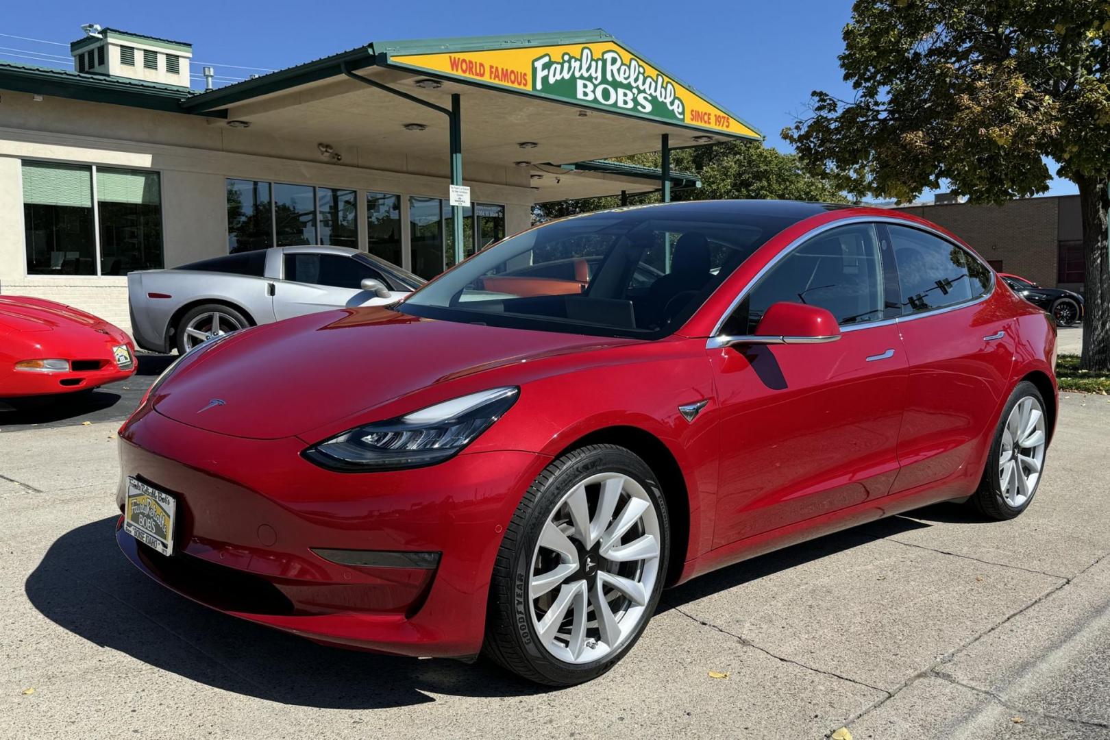 2018 Red Muti-Coat /Black Tesla Model 3 LR (5YJ3E1EA9JF) with an 75 kWh engine, Automatic transmission, located at 2304 W. Main St., Boise, ID, 83702, (208) 342-7777, 43.622105, -116.218658 - Photo#0