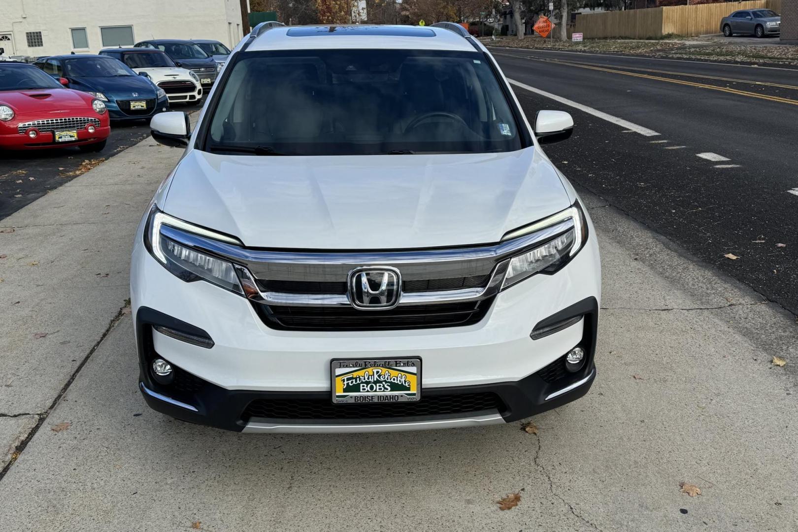 2021 Platinum White Pearl /Black Honda Pilot Touring (5FNYF6H96MB) with an V6 3.5 Liter engine, Automatic 9 Speed transmission, located at 2304 W. Main St., Boise, ID, 83702, (208) 342-7777, 43.622105, -116.218658 - 8 Passenger Seating! New Tires Too! - Photo#1