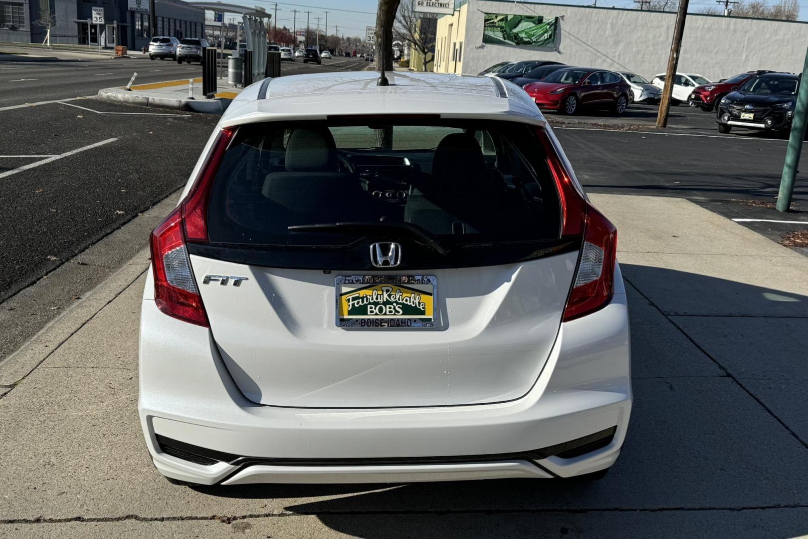 2019 White /Black Honda Fit LX (3HGGK5H42KM) with an 4 Cyl 1.5 Liter engine, Automatic transmission, located at 2304 W. Main St., Boise, ID, 83702, (208) 342-7777, 43.622105, -116.218658 - Great Fuel Economy! Great Cars! - Photo#1