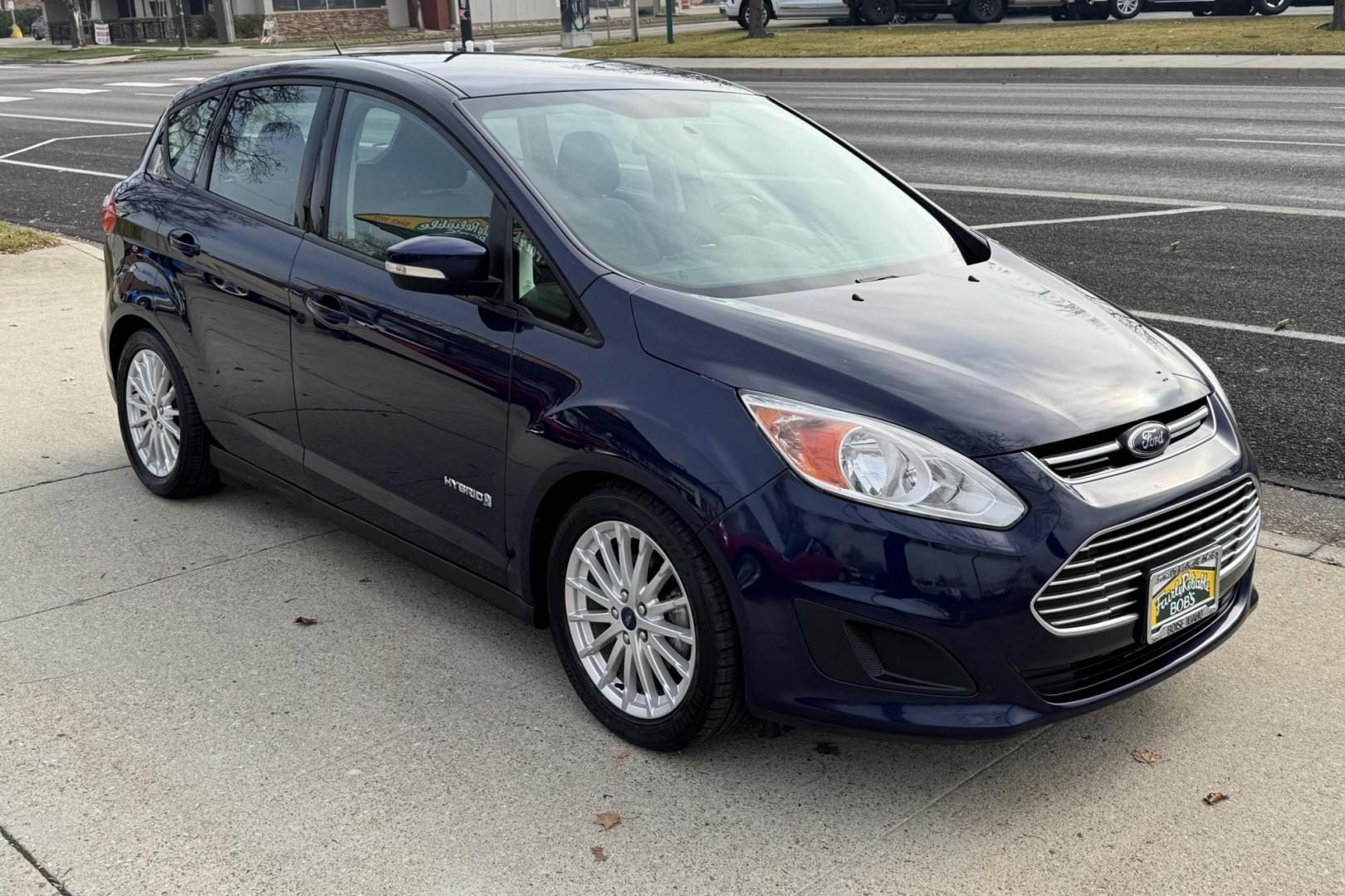 2016 Kona Blue /Gray Ford C-Max Hybrid SE (1FADP5AU5GL) with an 4 Cyl 2.0 Liter Hybrid engine, Automatic transmission, located at 2304 W. Main St., Boise, ID, 83702, (208) 342-7777, 43.622105, -116.218658 - New Tires! Great Fuel Economy! Upgraded To Apple Car Play/Android Auto! - Photo#1
