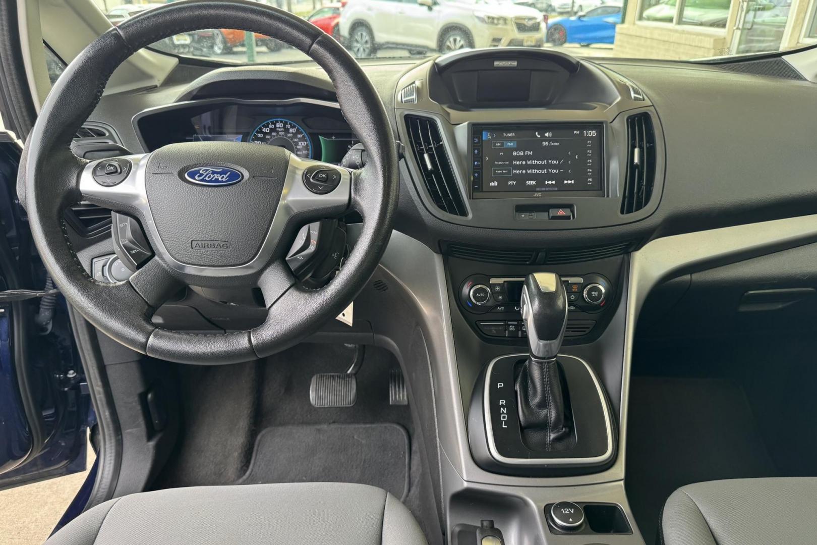 2016 Kona Blue /Gray Ford C-Max Hybrid SE (1FADP5AU5GL) with an 4 Cyl 2.0 Liter Hybrid engine, Automatic transmission, located at 2304 W. Main St., Boise, ID, 83702, (208) 342-7777, 43.622105, -116.218658 - New Tires! Great Fuel Economy! Upgraded To Apple Car Play/Android Auto! - Photo#7