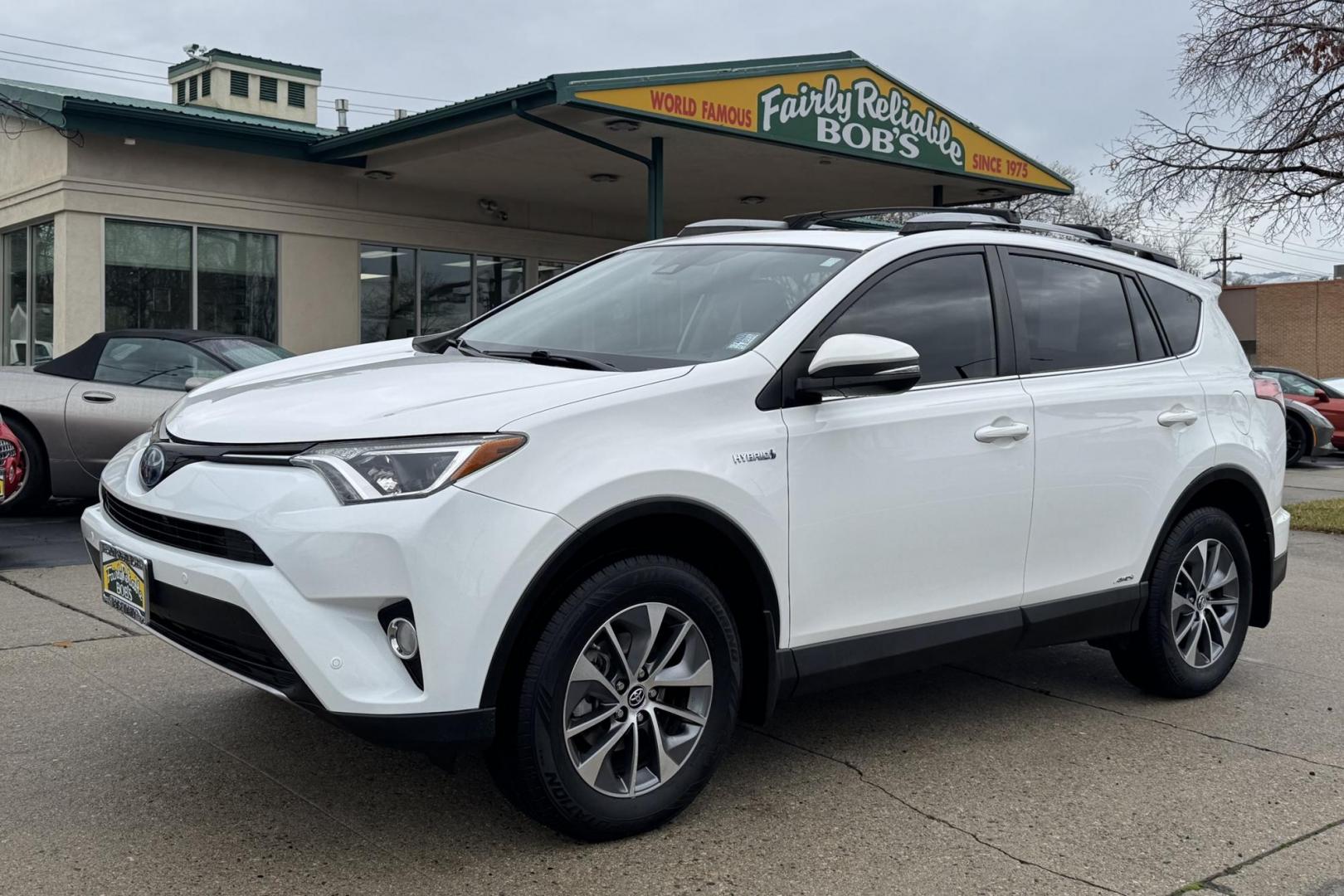 2018 Super White /Black Toyota RAV4 XLE (JTMRJREV1JD) with an 4 Cyl 2.5 Liter Hybrid engine, Automatic transmission, located at 2304 W. Main St., Boise, ID, 83702, (208) 342-7777, 43.622105, -116.218658 - Hard To Find! Great To Own! - Photo#0
