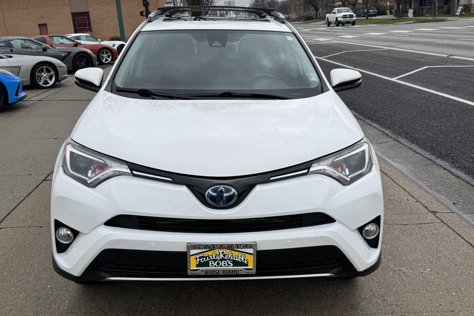 2018 Super White /Black Toyota RAV4 XLE (JTMRJREV1JD) with an 4 Cyl 2.5 Liter Hybrid engine, Automatic transmission, located at 2304 W. Main St., Boise, ID, 83702, (208) 342-7777, 43.622105, -116.218658 - Hard To Find! Great To Own! - Photo#1