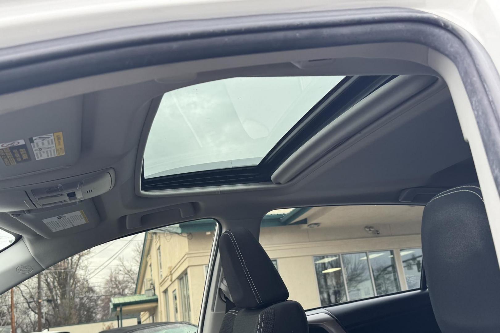 2018 Super White /Black Toyota RAV4 XLE (JTMRJREV1JD) with an 4 Cyl 2.5 Liter Hybrid engine, Automatic transmission, located at 2304 W. Main St., Boise, ID, 83702, (208) 342-7777, 43.622105, -116.218658 - Hard To Find! Great To Own! - Photo#4