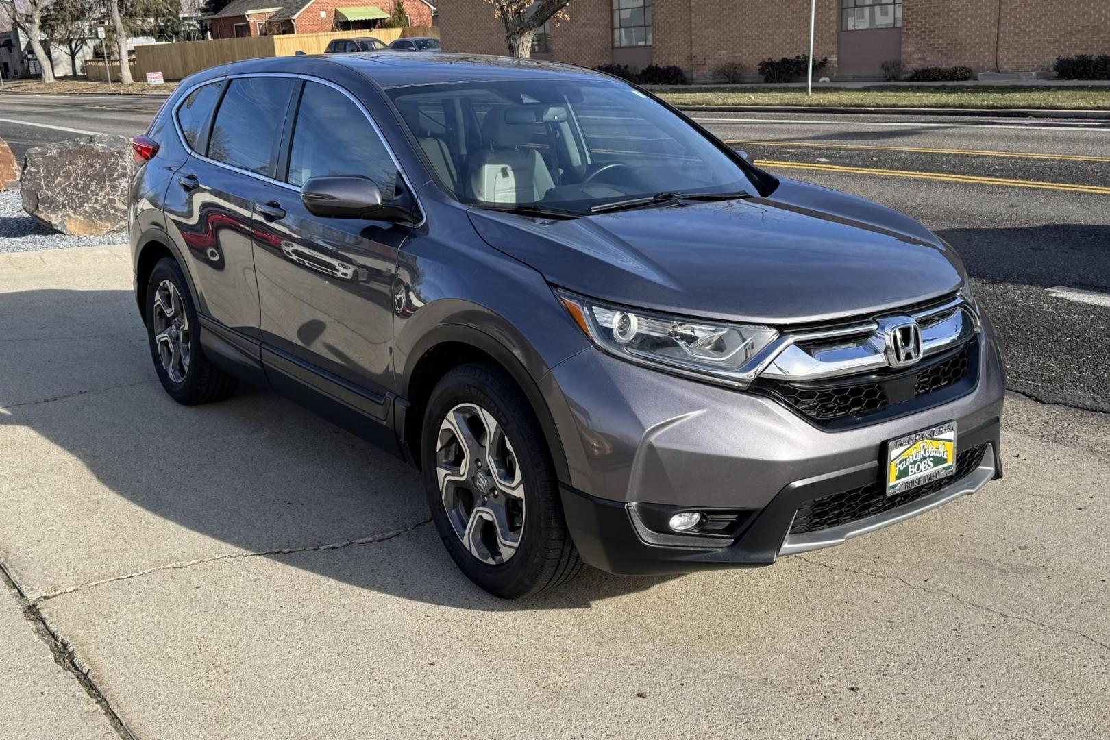 2018 Modern Steel Metallic /Light Gray Honda CR-V EX-L (7FARW1H82JE) with an 4 Cyl 1.5 Liter Turbo engine, Automatic transmission, located at 2304 W. Main St., Boise, ID, 83702, (208) 342-7777, 43.622105, -116.218658 - Clean And Well Optioned! - Photo#2