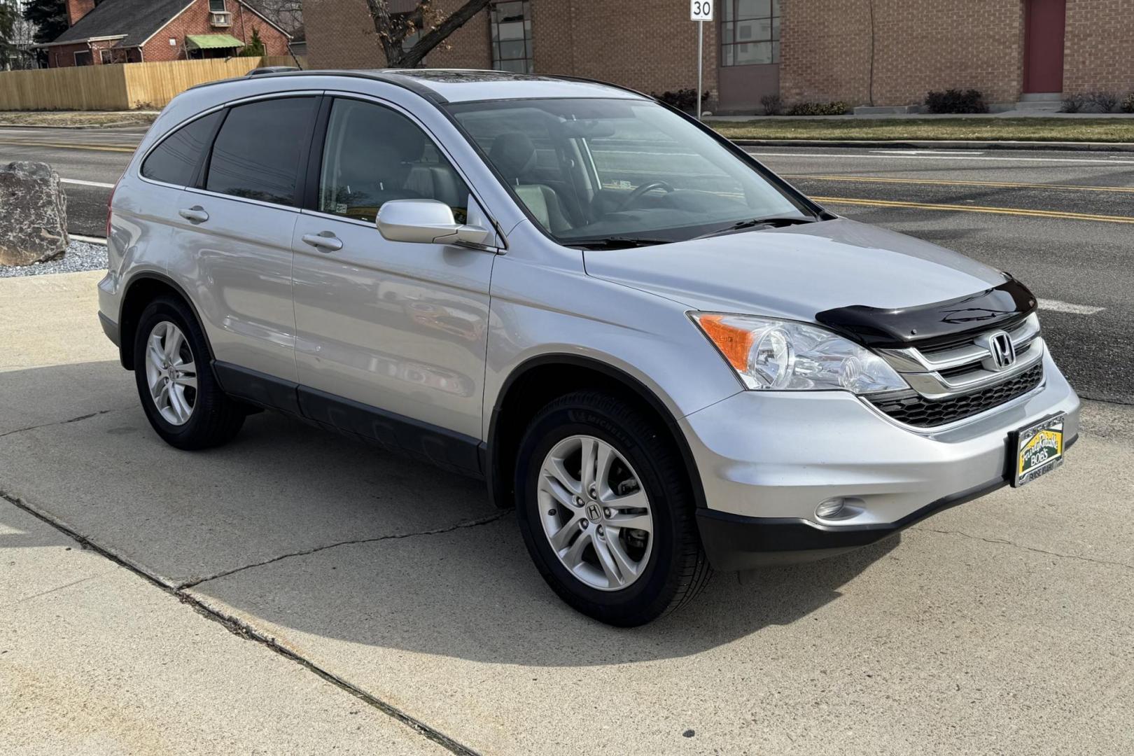 2011 Silver /Gray Honda CR-V EX-L (JHLRE4H78BC) with an 4 Cyl 2.4 Liter engine, Automatic transmission, located at 2304 W. Main St., Boise, ID, 83702, (208) 342-7777, 43.622105, -116.218658 - Hard To Find! Great To Own! - Photo#1