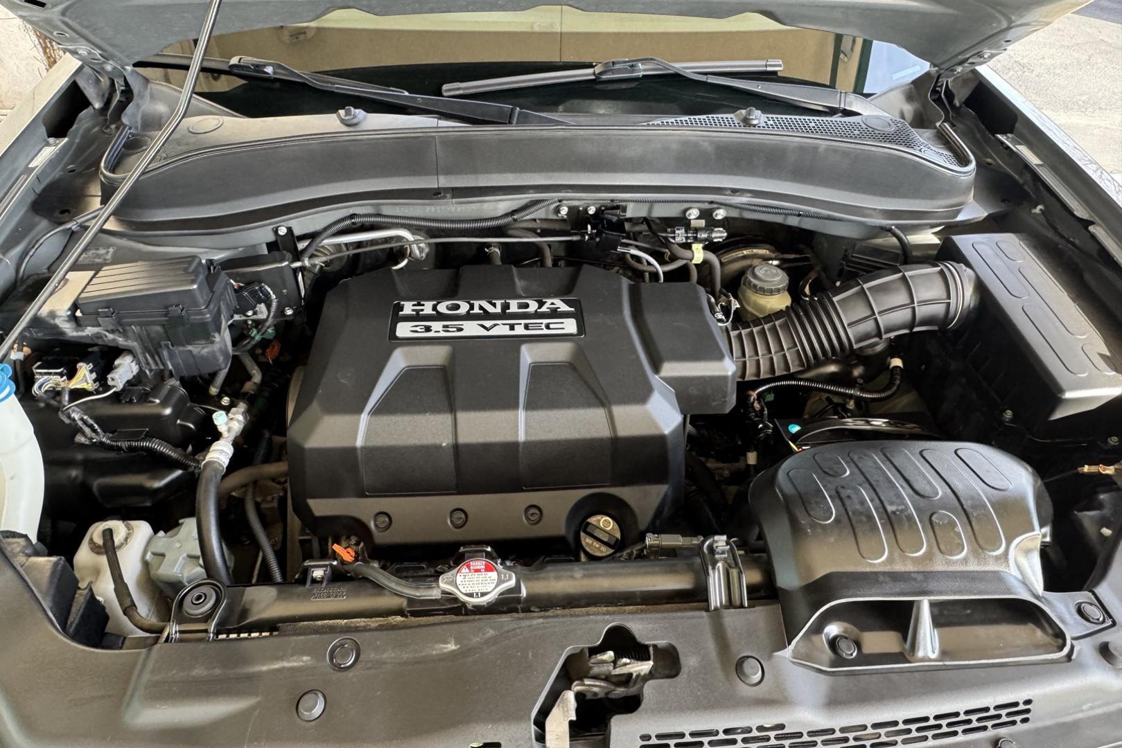 2007 Nimbus Gray /Gray Honda Ridgeline RTL (2HJYK16527H) with an V6 3.5 Liter engine, Automatic transmission, located at 2304 W. Main St., Boise, ID, 83702, (208) 342-7777, 43.622105, -116.218658 - One Owner Idaho Ridgeline! Amazing Condition! - Photo#16