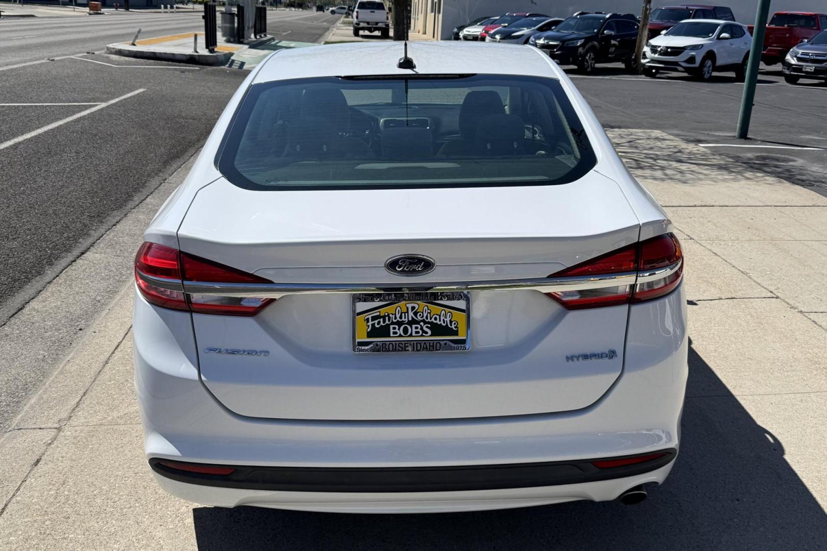 2018 Oxford White /Gray Ford Fusion Hybrid (3FA6P0UU5JR) with an 4 Cyl 2.0 Liter Hybrid engine, Automatic transmission, located at 2304 W. Main St., Boise, ID, 83702, (208) 342-7777, 43.622105, -116.218658 - Low Mileage, New Tires! Ready To Go! - Photo#1