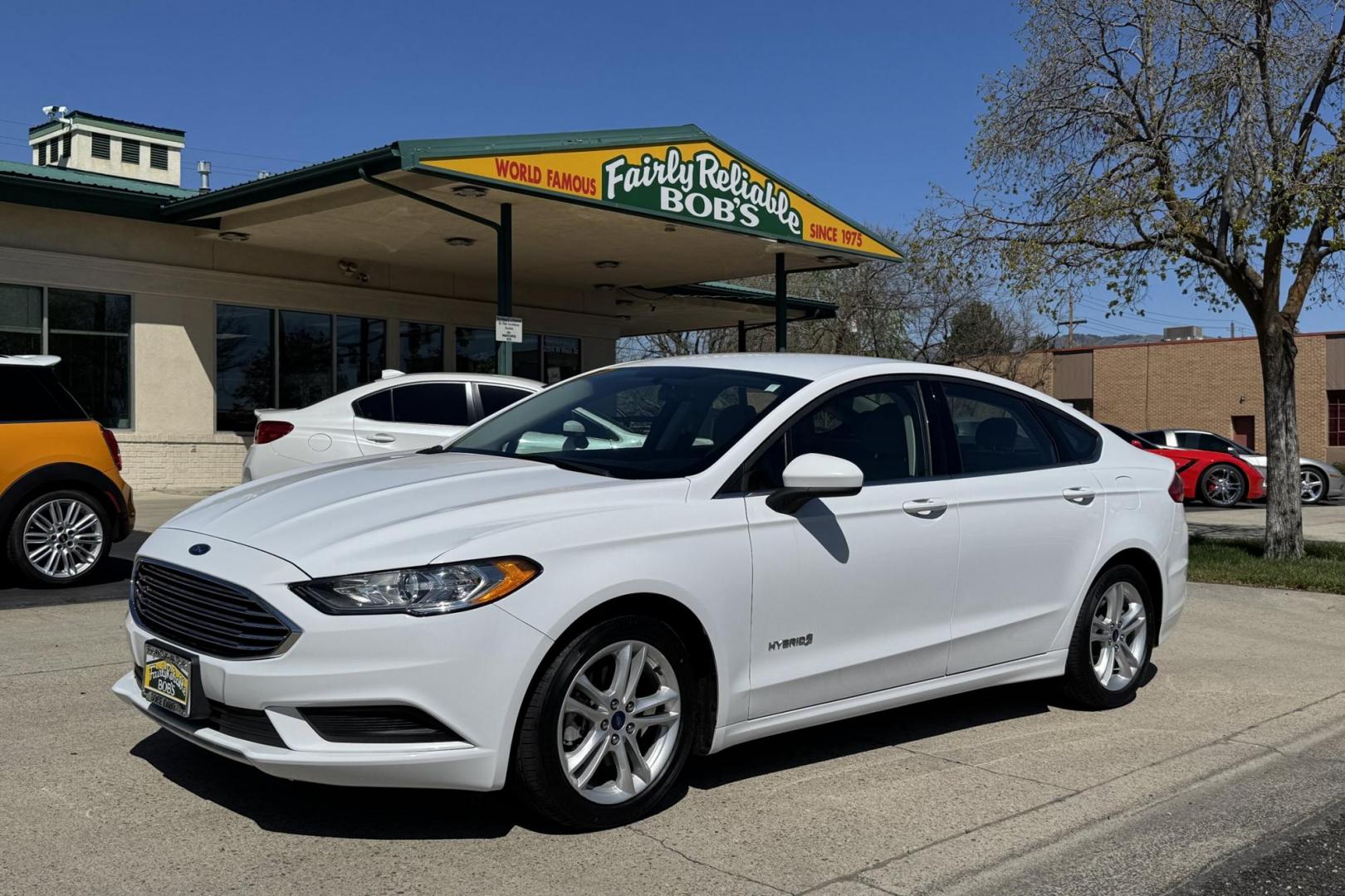 2018 Oxford White /Gray Ford Fusion Hybrid (3FA6P0UU5JR) with an 4 Cyl 2.0 Liter Hybrid engine, Automatic transmission, located at 2304 W. Main St., Boise, ID, 83702, (208) 342-7777, 43.622105, -116.218658 - Low Mileage, New Tires! Ready To Go! - Photo#0