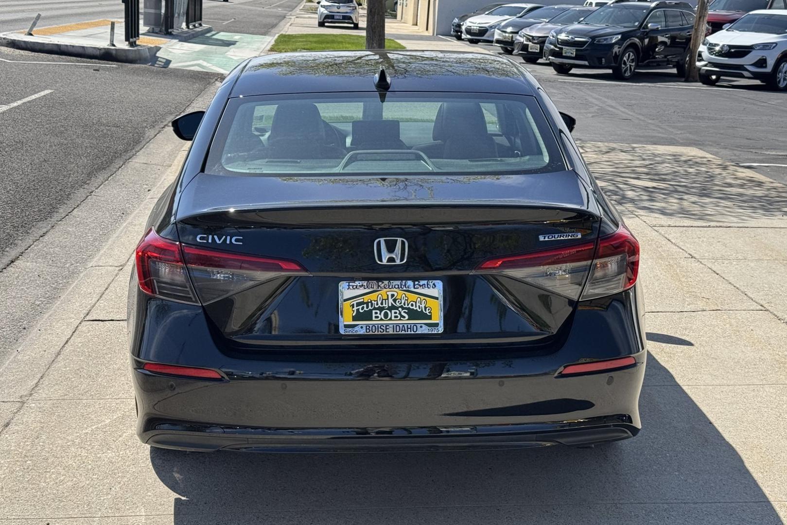 2022 Crystal Black Pearl /Black Honda Civic Touring (2HGFE1F95NH) with an 4 Cyl 1.5 Liter Turbo engine, Automatic transmission, located at 2304 W. Main St., Boise, ID, 83702, (208) 342-7777, 43.622105, -116.218658 - Remaining Factory Warranty! Great Cars! - Photo#1