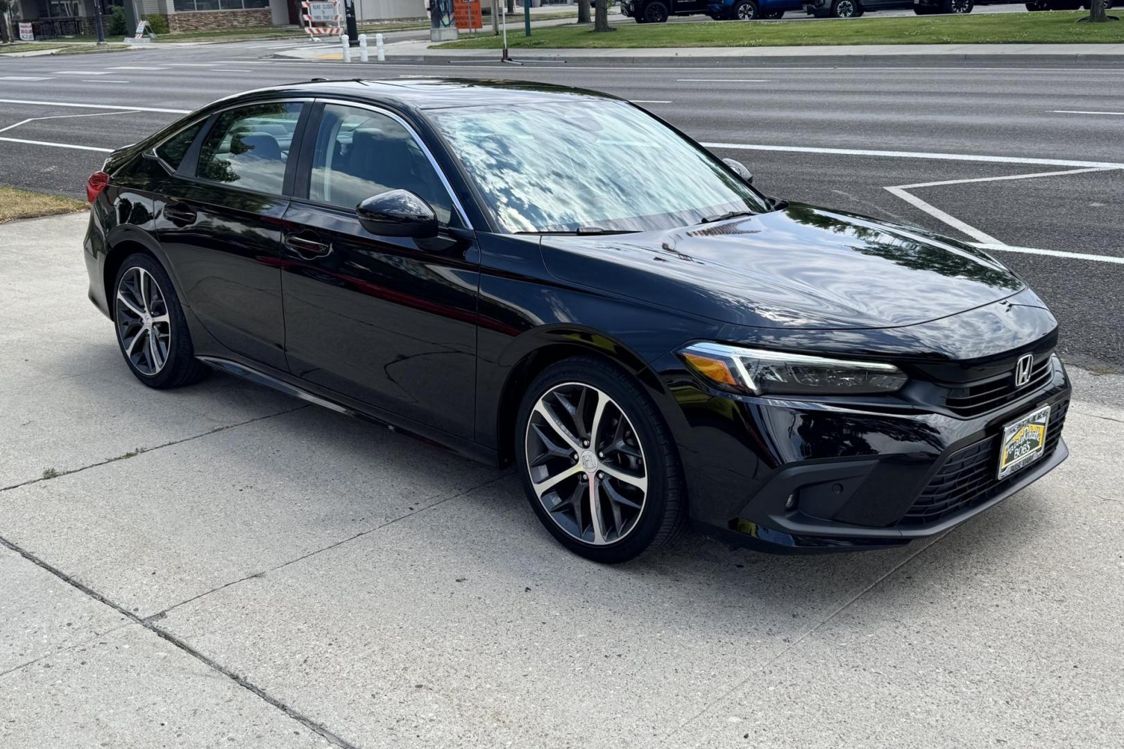 2022 Crystal Black Pearl /Black Honda Civic Touring (2HGFE1F95NH) with an 4 Cyl 1.5 Liter Turbo engine, Automatic transmission, located at 2304 W. Main St., Boise, ID, 83702, (208) 342-7777, 43.622105, -116.218658 - Remaining Factory Warranty! Great Cars! - Photo#2
