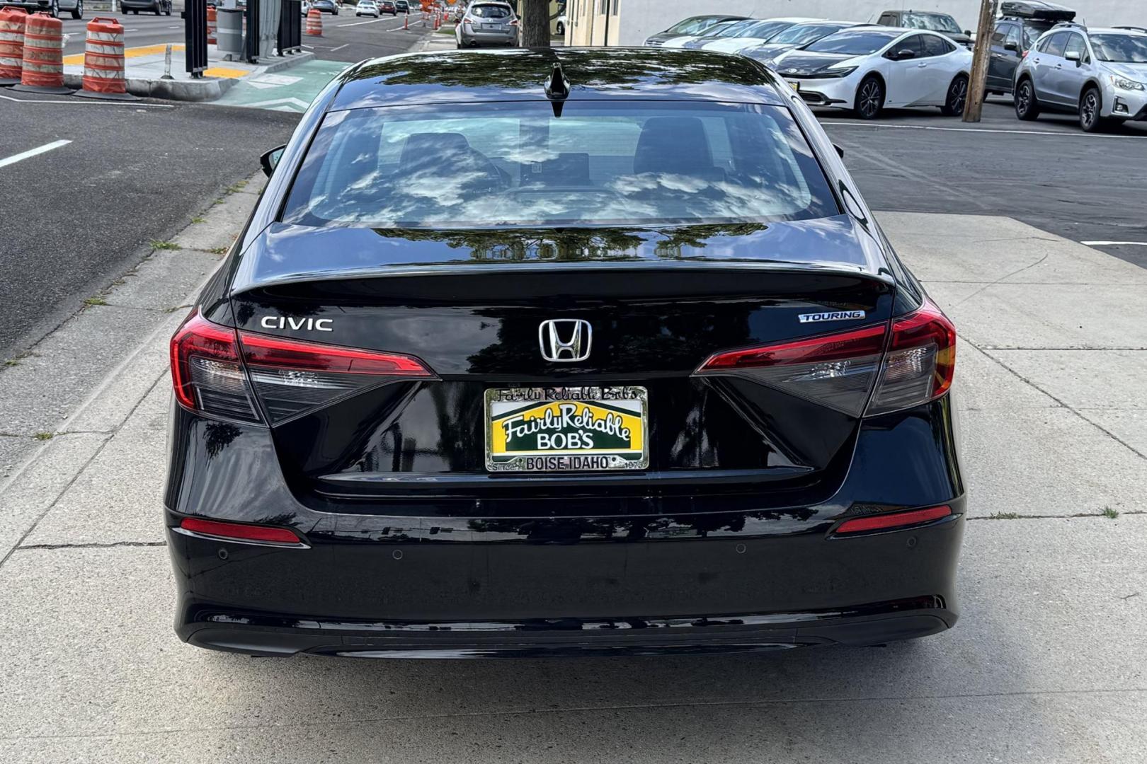 2022 Crystal Black Pearl /Black Honda Civic Touring (2HGFE1F95NH) with an 4 Cyl 1.5 Liter Turbo engine, Automatic transmission, located at 2304 W. Main St., Boise, ID, 83702, (208) 342-7777, 43.622105, -116.218658 - Remaining Factory Warranty! Great Cars! - Photo#1