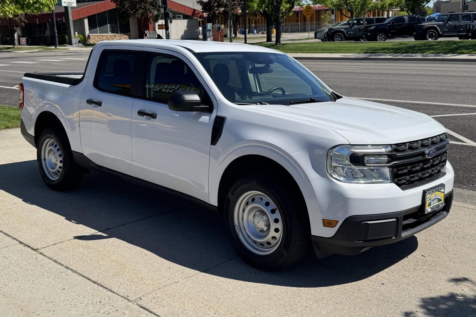 2023 Oxford White /Black Ford Maverick XL (3FTTW8E95PR) with an 4 Cyl 2.0 Liter Turbo engine, Automatic 8 Speed transmission, located at 2304 W. Main St., Boise, ID, 83702, (208) 342-7777, 43.622105, -116.218658 - Great Fuel Economy With Truck Functionality! - Photo#2
