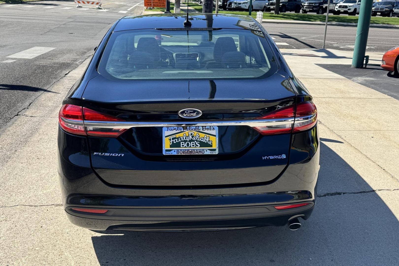 2018 Black /Tan Ford Fusion (3FA6P0UU8JR) with an 4 Cyl 2.0 Liter Hybrid engine, Automatic transmission, located at 2304 W. Main St., Boise, ID, 83702, (208) 342-7777, 43.622105, -116.218658 - Great Fuel Economy! Great Value! - Photo#2