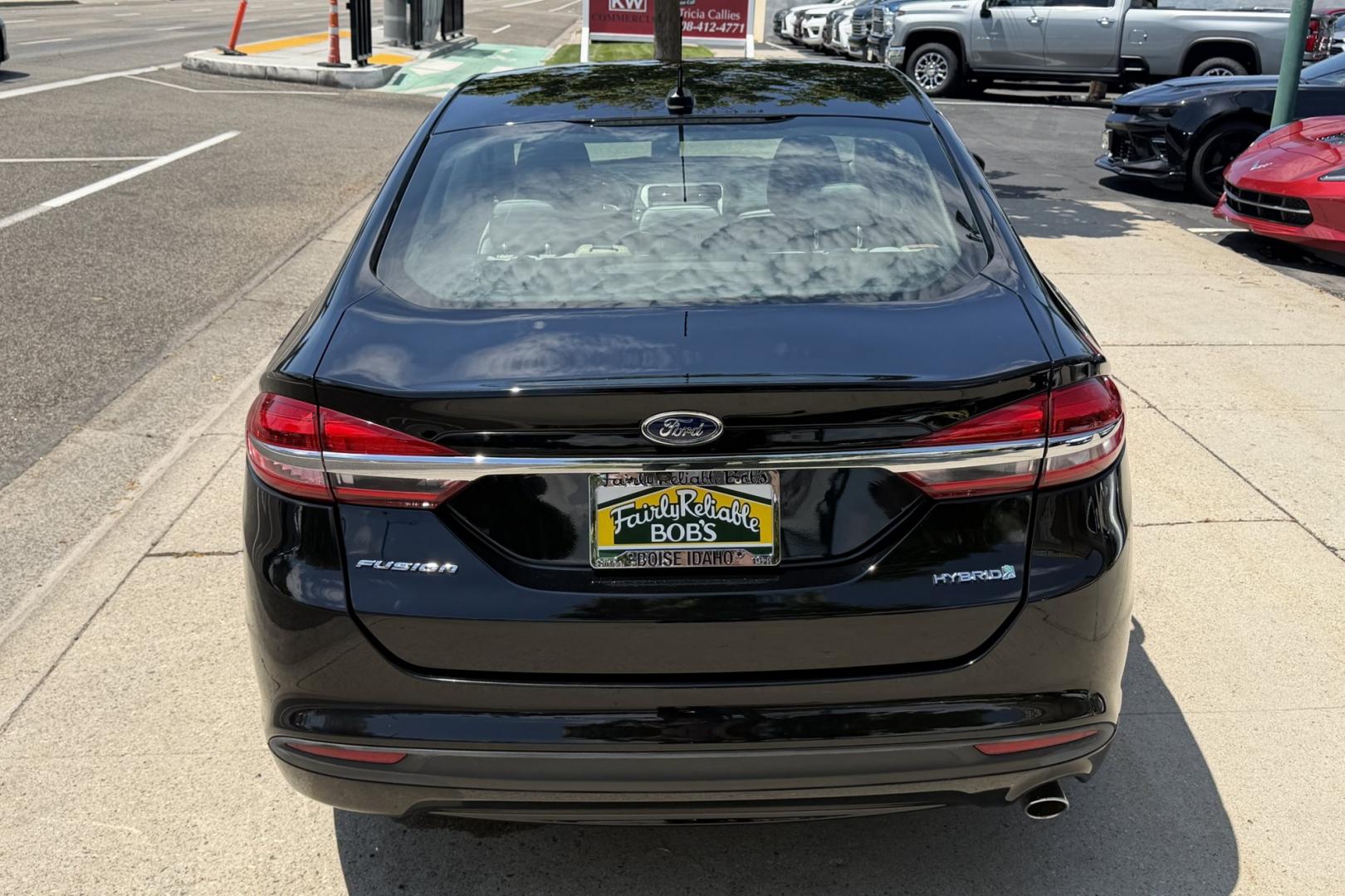 2018 Black /Gray Ford Fusion (3FA6P0UU8JR) with an 4 Cyl 2.0 Liter Hybrid engine, Automatic transmission, located at 2304 W. Main St., Boise, ID, 83702, (208) 342-7777, 43.622105, -116.218658 - Great Fuel Economy! Great Value!- Photo#1