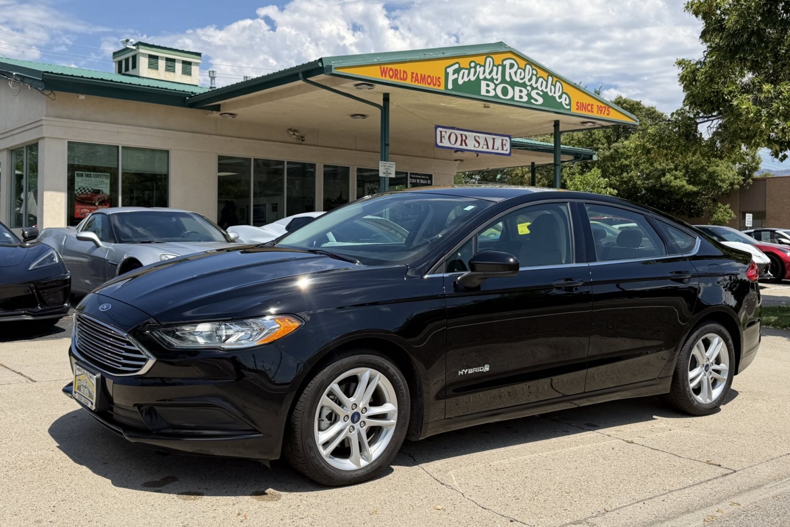 2018 Black /Gray Ford Fusion (3FA6P0UU8JR) with an 4 Cyl 2.0 Liter Hybrid engine, Automatic transmission, located at 2304 W. Main St., Boise, ID, 83702, (208) 342-7777, 43.622105, -116.218658 - Great Fuel Economy! Great Value!- Photo#0