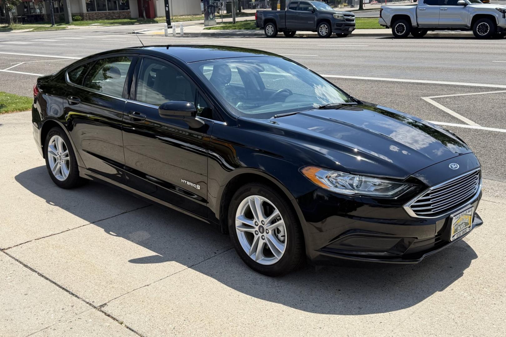 2018 Black /Gray Ford Fusion (3FA6P0UU8JR) with an 4 Cyl 2.0 Liter Hybrid engine, Automatic transmission, located at 2304 W. Main St., Boise, ID, 83702, (208) 342-7777, 43.622105, -116.218658 - Great Fuel Economy! Great Value!- Photo#2