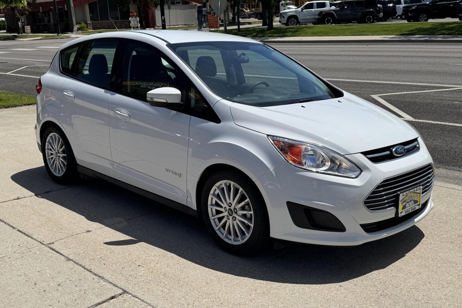 2016 Oxford White /Black Ford C-Max Hybrid SE (1FADP5AU7GL) with an 4 Cyl 2.0 Liter Hybrid engine, Automatic transmission, located at 2304 W. Main St., Boise, ID, 83702, (208) 342-7777, 43.622105, -116.218658 - Great Fuel Economy, Low Mileage And New Tires! - Photo#2