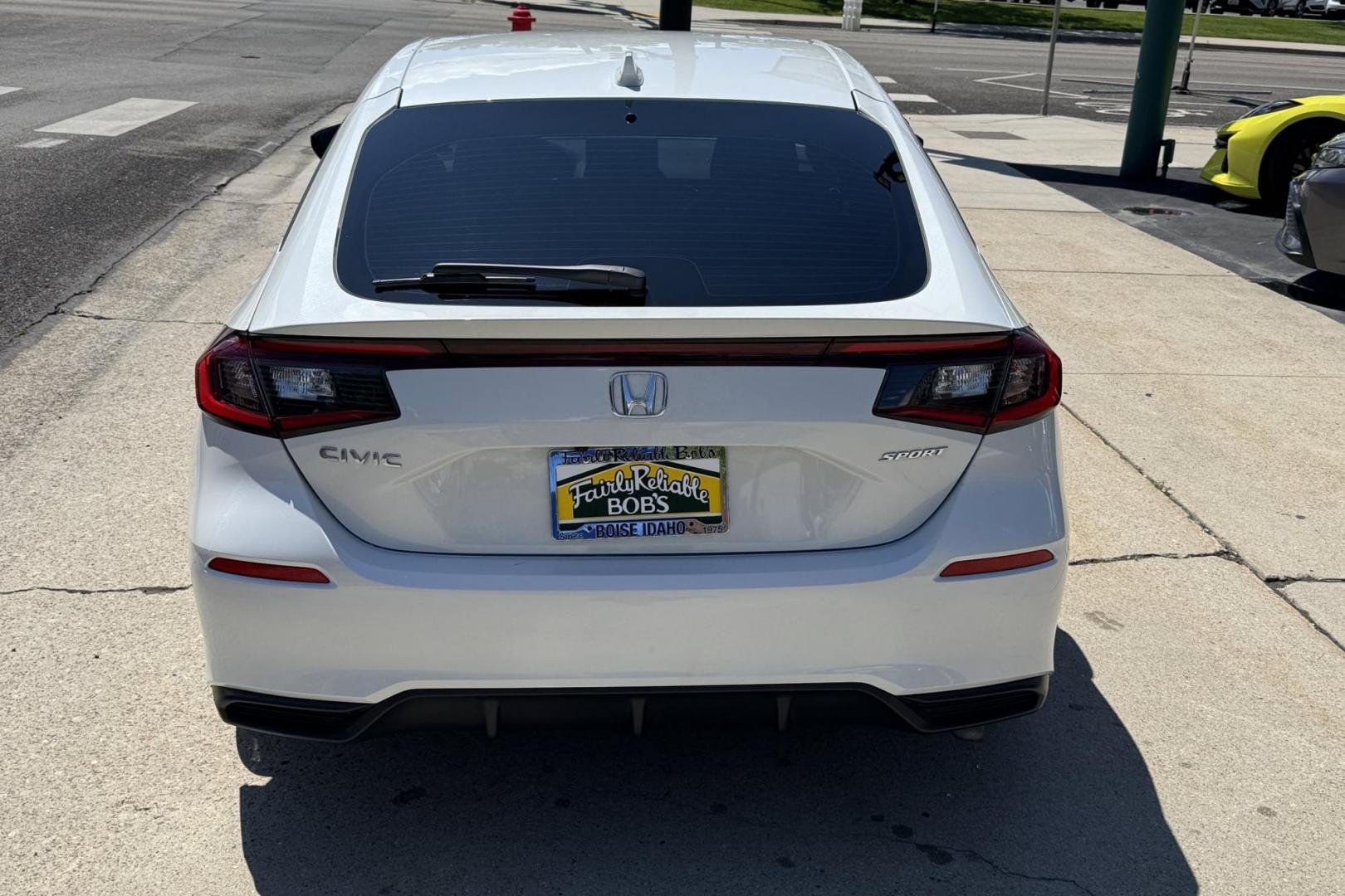 2024 White /Black Honda Civic Hatchback Sport (19XFL2H80RE) with an 4 Cyl 2.0 Liter engine, Automatic transmission, located at 2304 W. Main St., Boise, ID, 83702, (208) 342-7777, 43.622105, -116.218658 - Remaining Factory Warranty! Fun To Drive! - Photo#1