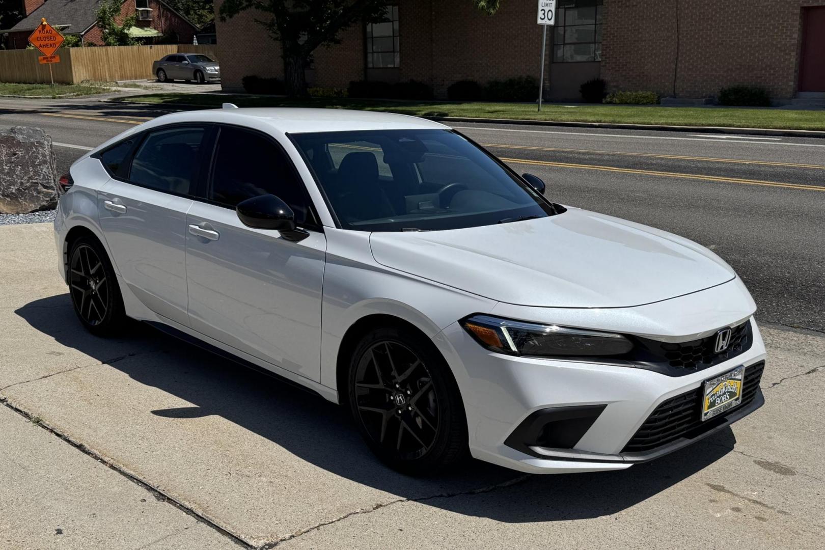 2024 White /Black Honda Civic Hatchback Sport (19XFL2H80RE) with an 4 Cyl 2.0 Liter engine, Automatic transmission, located at 2304 W. Main St., Boise, ID, 83702, (208) 342-7777, 43.622105, -116.218658 - Remaining Factory Warranty! Fun To Drive! - Photo#2
