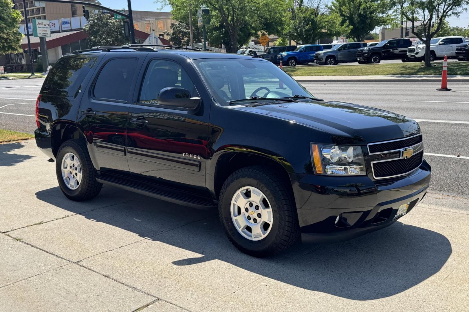 2014 Black /Black Chevrolet Tahoe LT (1GNSKBE08ER) with an V8 5.3 Liter engine, Automatic transmission, located at 2304 W. Main St., Boise, ID, 83702, (208) 342-7777, 43.622105, -116.218658 - New Tires! 8 Passenger! - Photo#2