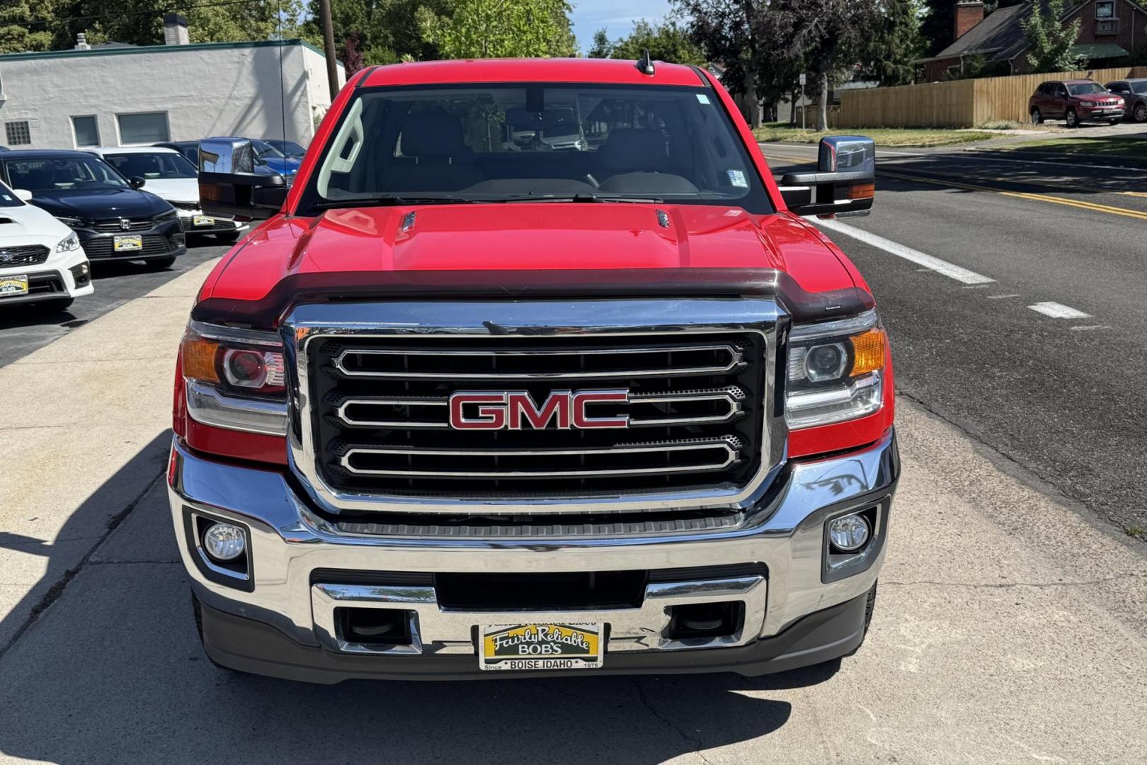 2016 Victory Red /Tan GMC Sierra 3500HD SLT (1GT42XC89GF) with an V8 6.6 Liter Turbo Duramax Diesel engine, Automatic 6 Speed With Overdrive Allison transmission, located at 2304 W. Main St., Boise, ID, 83702, (208) 342-7777, 43.622105, -116.218658 - Long Bed! Capable Hauler! - Photo#3