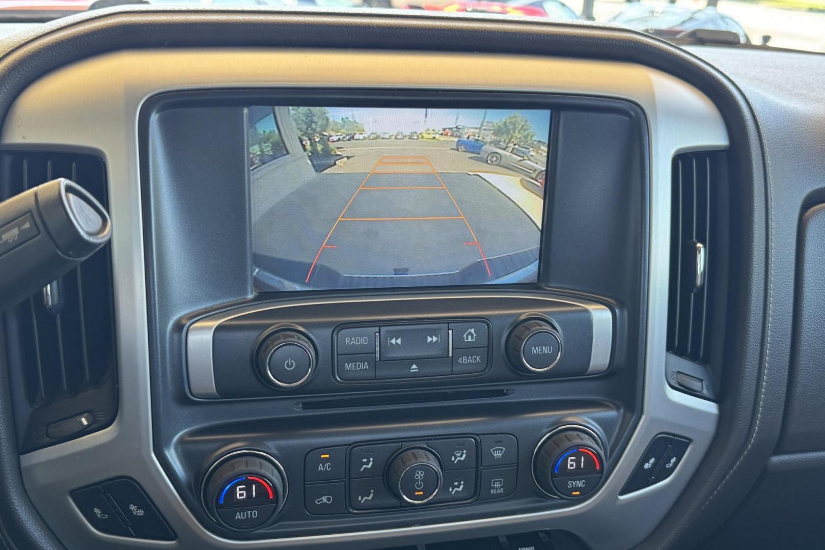 2016 Victory Red /Tan GMC Sierra 3500HD SLT (1GT42XC89GF) with an V8 6.6 Liter Turbo Duramax Diesel engine, Automatic 6 Speed With Overdrive Allison transmission, located at 2304 W. Main St., Boise, ID, 83702, (208) 342-7777, 43.622105, -116.218658 - Long Bed! Capable Hauler! - Photo#5