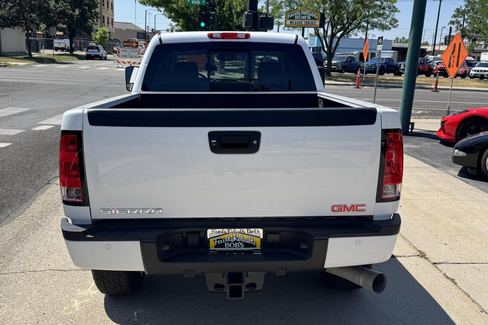 2014 Summit White /Oak GMC Sierra 2500HD Denali (1GT125E86EF) with an V8 6.6 Liter Turbo Duramax Diesel engine, Automatic 6 Speed With Overdrive Allison transmission, located at 2304 W. Main St., Boise, ID, 83702, (208) 342-7777, 43.622105, -116.218658 - Highly Optioned And Low Mileage Denali Crew Cab Long Bed! - Photo#1
