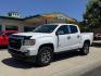 2022 Summit White /Jet Black GMC Canyon AT4 (1GTG6FEN8N1) with an V6 3.6 Liter engine, Automatic 8 Speed transmission, located at 2304 W. Main St., Boise, ID, 83702, (208) 342-7777, 43.622105, -116.218658 - Photo#0