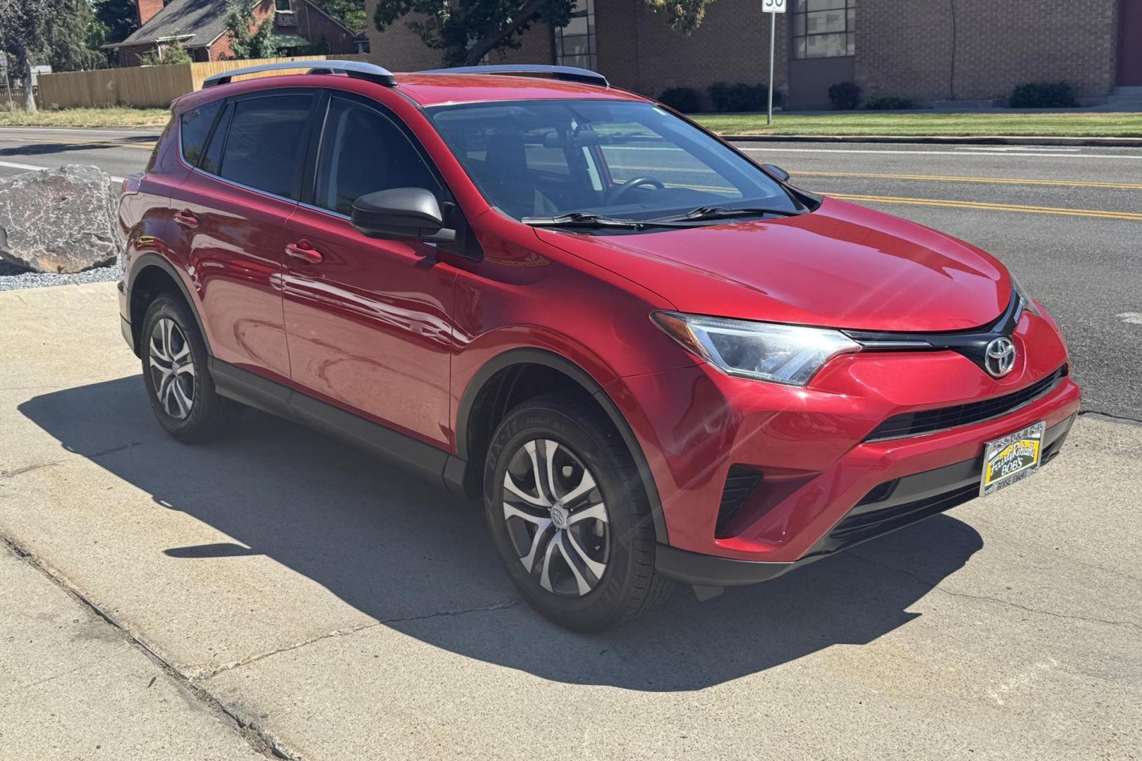 2016 Barcelona Red Metallic /Black Toyota RAV4 LE (2T3BFREVXGW) with an 4 Cyl 2.5 Liter engine, Automatic transmission, located at 2304 W. Main St., Boise, ID, 83702, (208) 342-7777, 43.622105, -116.218658 - Hard To Find! Great To Own! - Photo#2
