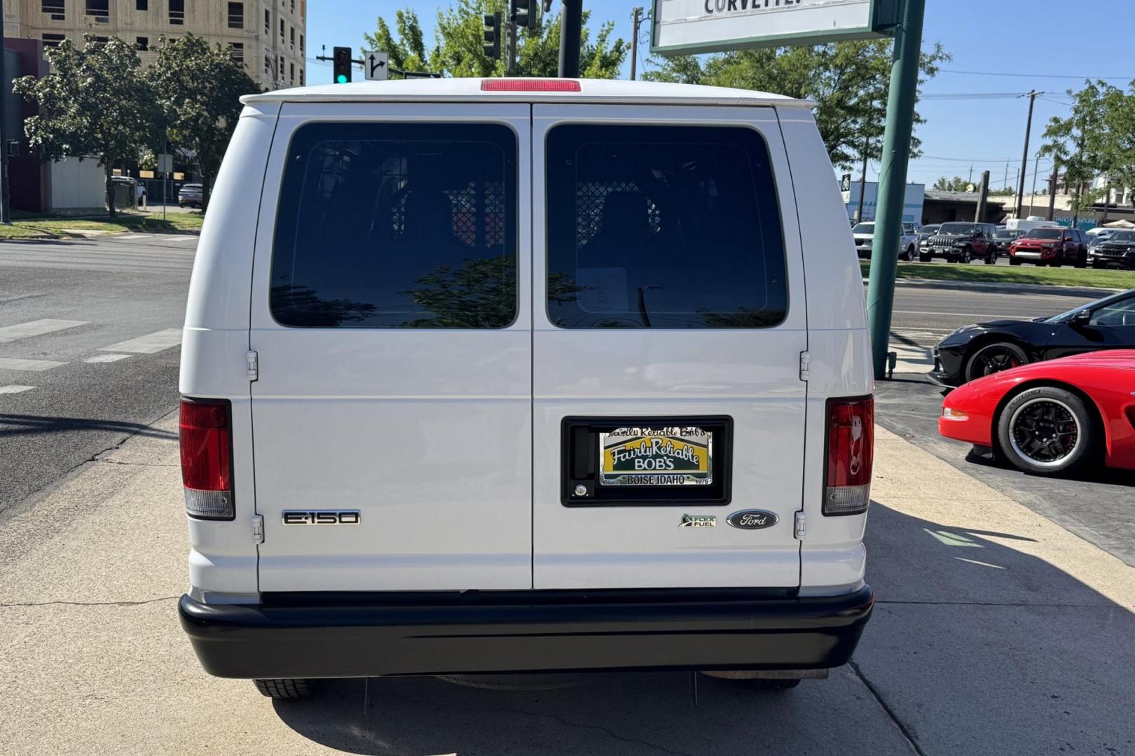 2009 Oxford White /Gray Ford E-150 (1FTNE14W09D) with an V8 4.6 Liter engine, Automatic transmission, located at 2304 W. Main St., Boise, ID, 83702, (208) 342-7777, 43.622105, -116.218658 - Very Clean Commercial Van! - Photo#1