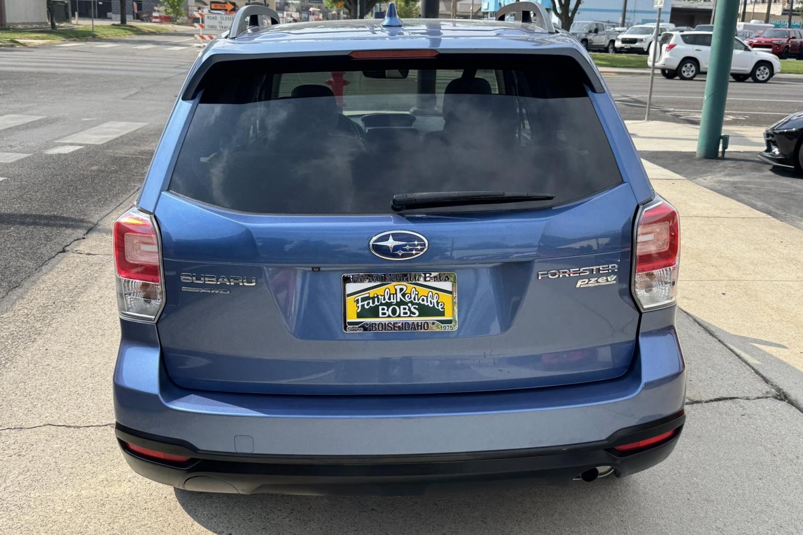 2018 Quartz Blue Pearl /Gray Subaru Forester Premium (JF2SJAGCXJH) with an H4 2.5 Liter engine, Automatic transmission, located at 2304 W. Main St., Boise, ID, 83702, (208) 342-7777, 43.622105, -116.218658 - Clean Low Mileage Forester! - Photo#1