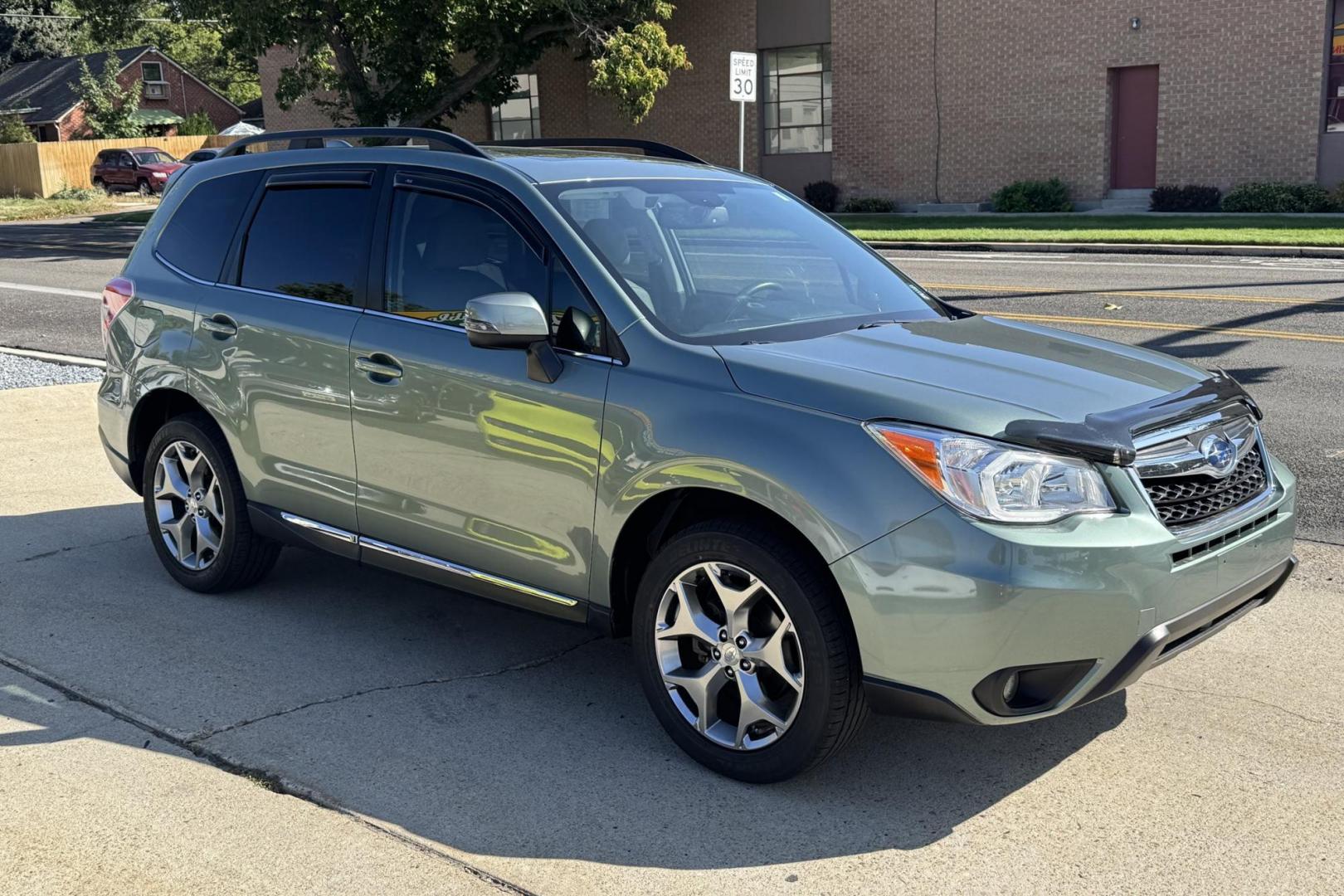 2016 Jasmine Green Metallic /Platinum Leather Subaru Forester Touring (JF2SJAXC7GH) with an H4 2.5 Liter engine, Automatic transmission, located at 2304 W. Main St., Boise, ID, 83702, (208) 342-7777, 43.622105, -116.218658 - Highly Optioned And Low Mileage Forester Touring! New Tires Too! - Photo#2