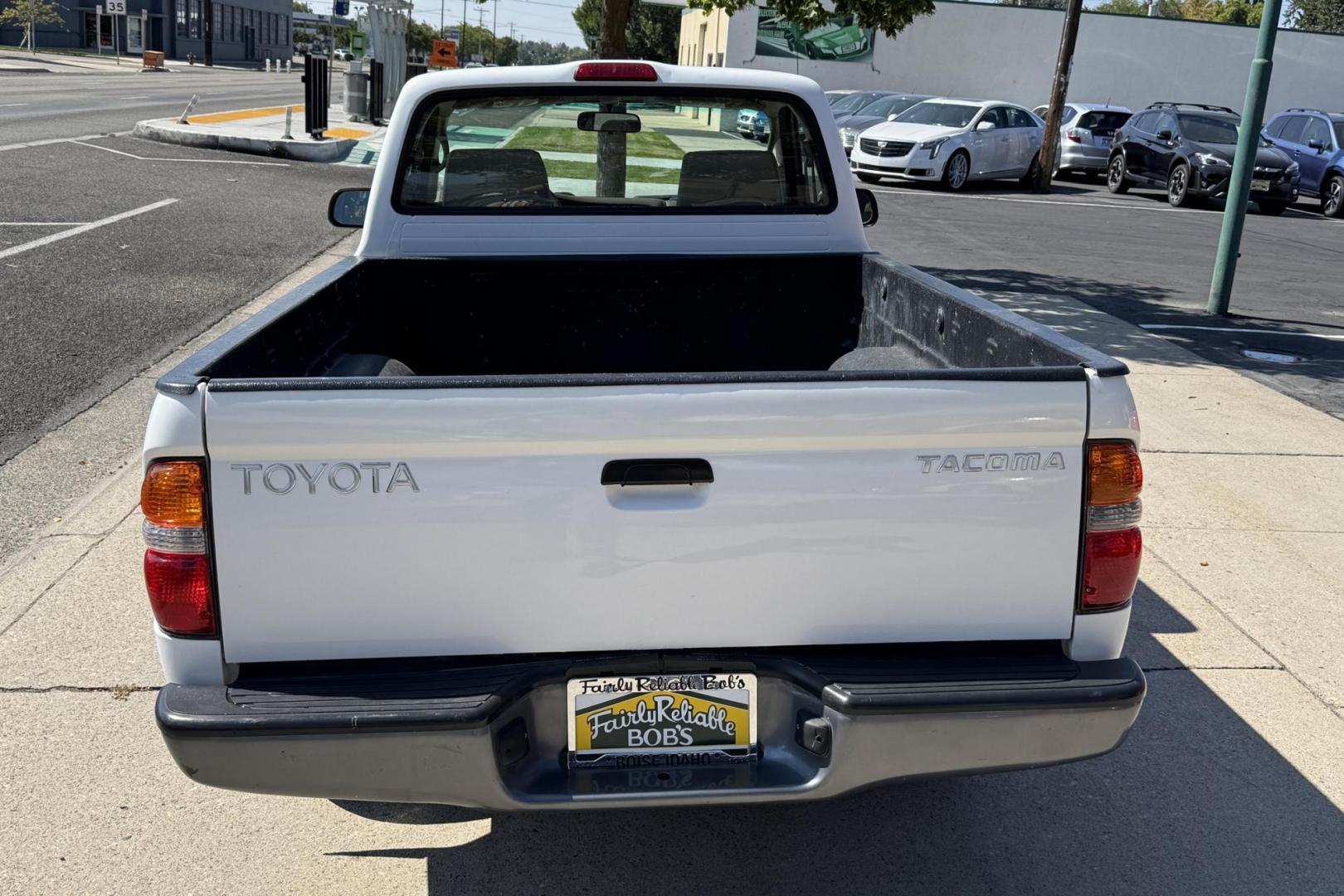 2002 White /Tan Toyota Tacoma (5TENL42N12Z) with an 2.4L L4 DOHC 16V engine, 5 Speed transmission, located at 2304 W. Main St., Boise, ID, 83702, (208) 342-7777, 43.622105, -116.218658 - Timeless And Reliable Tacoma! - Photo#1