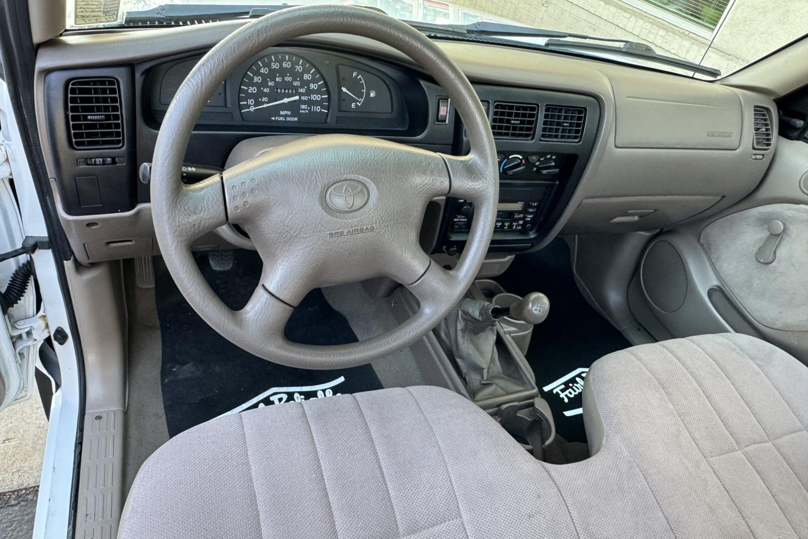 2002 White /Tan Toyota Tacoma (5TENL42N12Z) with an 2.4L L4 DOHC 16V engine, 5 Speed transmission, located at 2304 W. Main St., Boise, ID, 83702, (208) 342-7777, 43.622105, -116.218658 - Timeless And Reliable Tacoma! - Photo#6