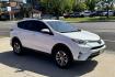 2018 White /Black Toyota RAV4 XLE (JTMRJREV5JD) with an 4 Cyl 2.5 Liter Hybrid engine, Automatic transmission, located at 2304 W. Main St., Boise, ID, 83702, (208) 342-7777, 43.622105, -116.218658 - Hybrid All Wheel Drive RAV4! Ready To Go! - Photo#2