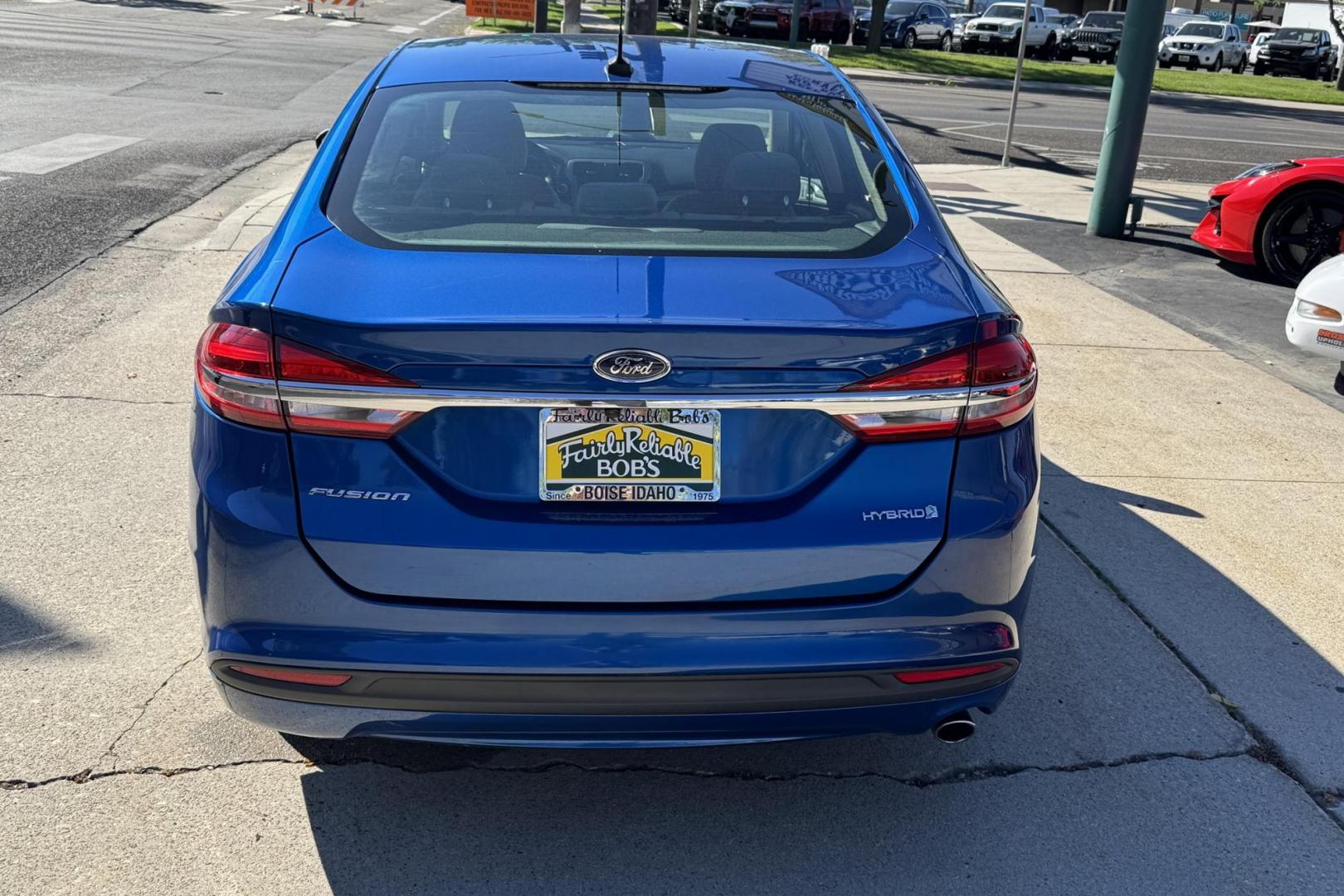 2018 Blue Lightning Metallic /Gray Ford Fusion (3FA6P0UU3JR) with an 4 Cyl 2.0 Liter Hybrid engine, Automatic transmission, located at 2304 W. Main St., Boise, ID, 83702, (208) 342-7777, 43.622105, -116.218658 - Great Fuel Economy! Smooth Ride Too! - Photo#1