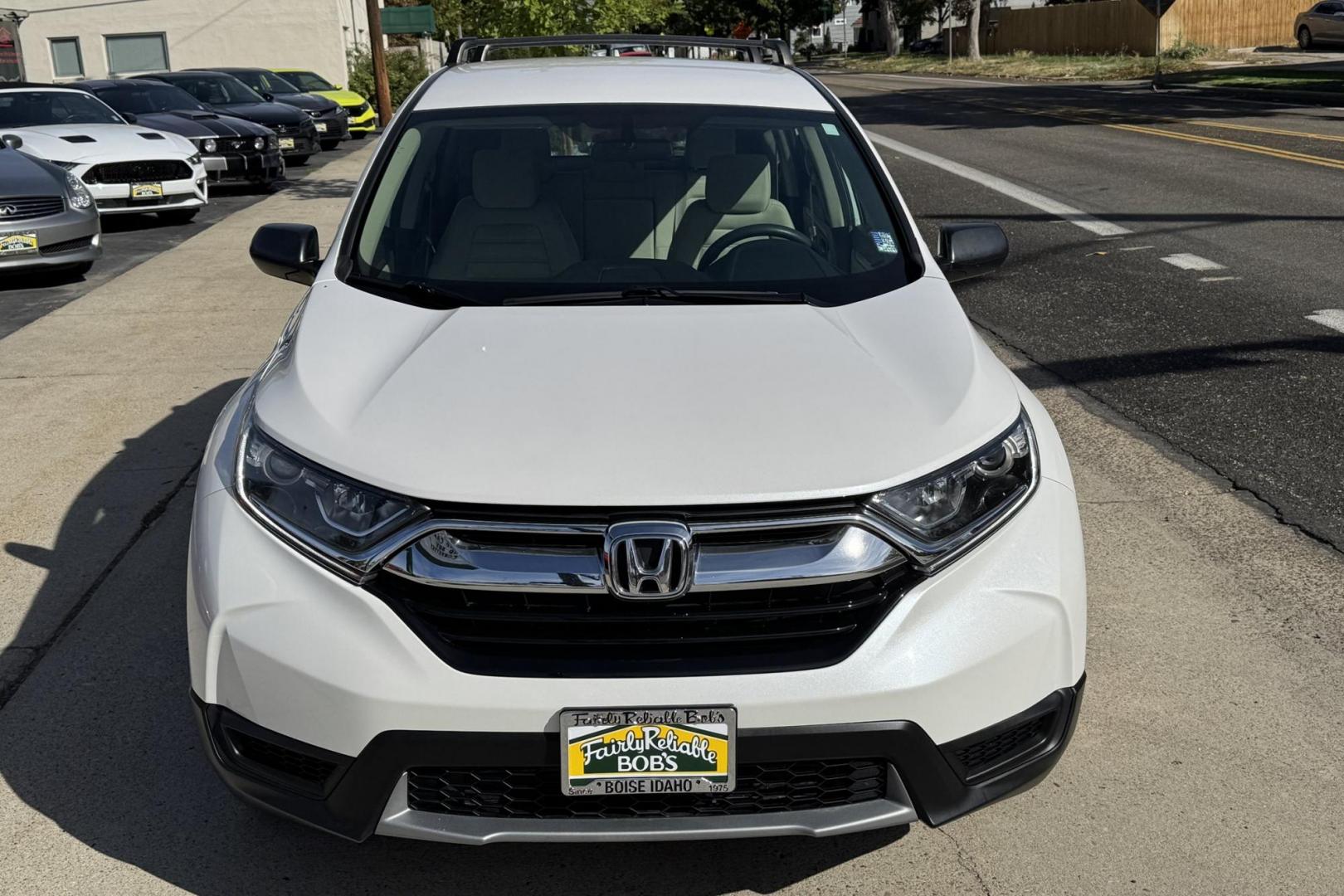 2019 Pearl White /Tan Honda CR-V LX (5J6RW6H30KL) with an 4 Cyl 2.4 Liter engine, Automatic transmission, located at 2304 W. Main St., Boise, ID, 83702, (208) 342-7777, 43.622105, -116.218658 - Great All Wheel Drive Option! - Photo#4