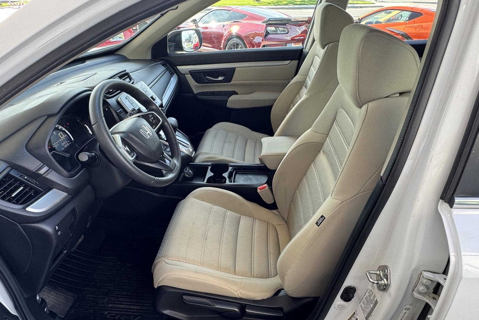 2019 Pearl White /Tan Honda CR-V LX (5J6RW6H30KL) with an 4 Cyl 2.4 Liter engine, Automatic transmission, located at 2304 W. Main St., Boise, ID, 83702, (208) 342-7777, 43.622105, -116.218658 - Great All Wheel Drive Option! - Photo#7