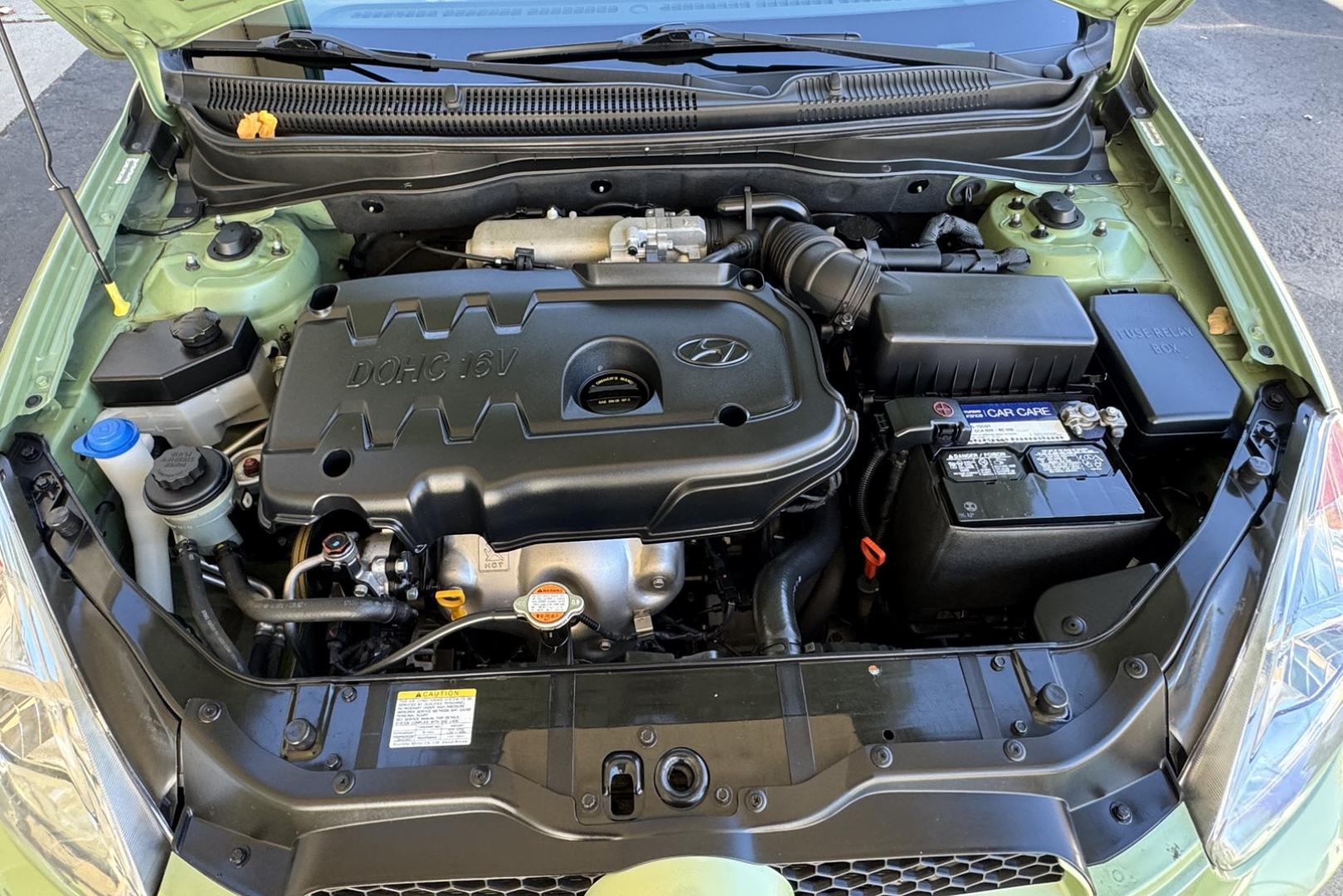 2008 Apple Green /Black Hyundai Accent GS (KMHCM36C98U) with an 4 Cyl 1.6 Liter engine, Automatic transmission, located at 2304 W. Main St., Boise, ID, 83702, (208) 342-7777, 43.622105, -116.218658 - One Of A Kind! Incredibly Low Mileage On This Gas Miser! - Photo#7