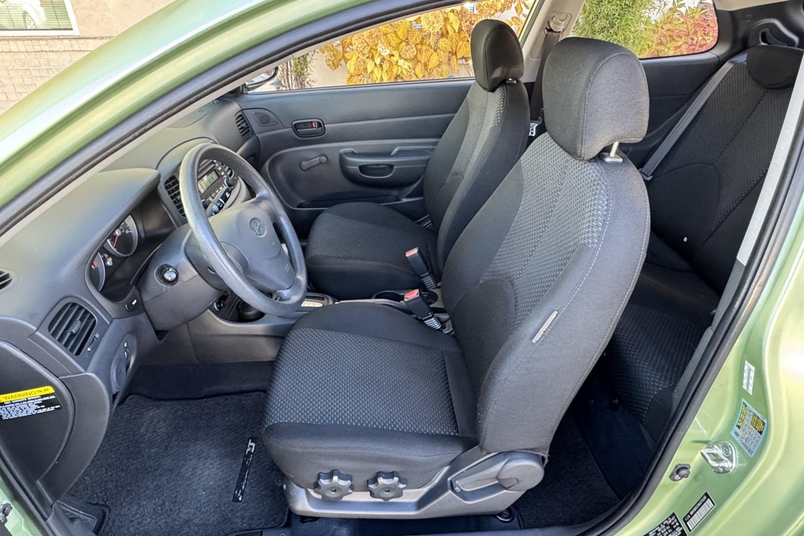 2008 Apple Green /Black Hyundai Accent GS (KMHCM36C98U) with an 4 Cyl 1.6 Liter engine, Automatic transmission, located at 2304 W. Main St., Boise, ID, 83702, (208) 342-7777, 43.622105, -116.218658 - One Of A Kind! Incredibly Low Mileage On This Gas Miser! - Photo#6