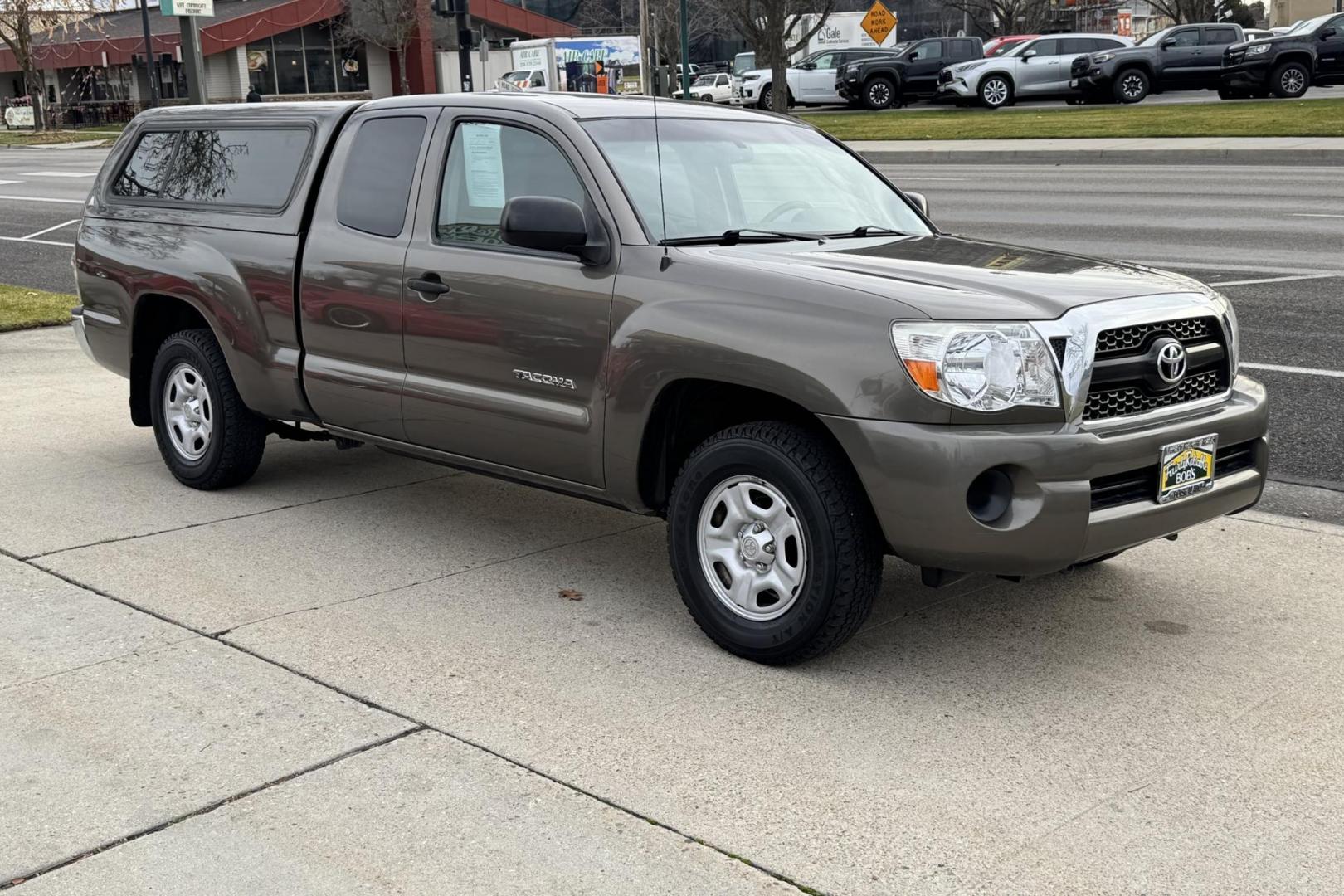2011 Pyrite Mica /Gray Toyota Tacoma (5TFTX4CN0BX) with an 4 Cyl 2.7 Liter engine, Automatic transmission, located at 2304 W. Main St., Boise, ID, 83702, (208) 342-7777, 43.622105, -116.218658 - Own The Legend! - Photo#2