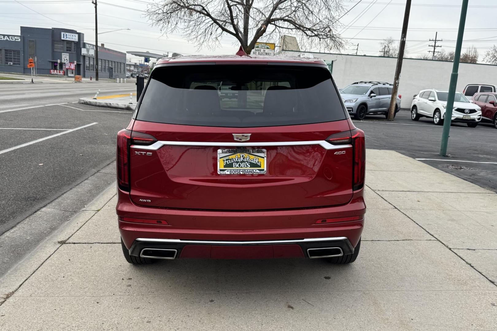 2024 Crystal Red /Cashmere Cadillac XT6 Premium Luxury (1GYKPDRS2RZ) with an V6 3.5 Liter engine, Automatic 9 Speed transmission, located at 2304 W. Main St., Boise, ID, 83702, (208) 342-7777, 43.622105, -116.218658 - 7 Passenger! Power Rear Third Row! Push Button Fold Down Second Row! Ready To Go! - Photo#1