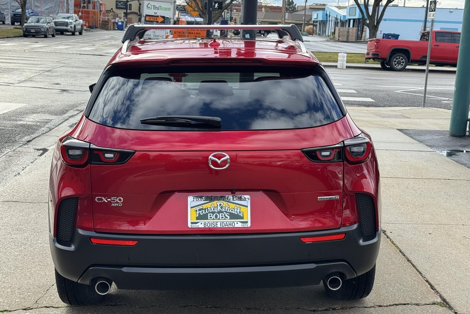 2023 Red Crystal Metallic /Black Mazda CX-50 Premium Plus (7MMVABEM3PN) with an 4 Cyl 2.5 Liter engine, Automatic 6 Speed transmission, located at 2304 W. Main St., Boise, ID, 83702, (208) 342-7777, 43.622105, -116.218658 - New Tires! Very Clean And Fun To Drive! - Photo#1