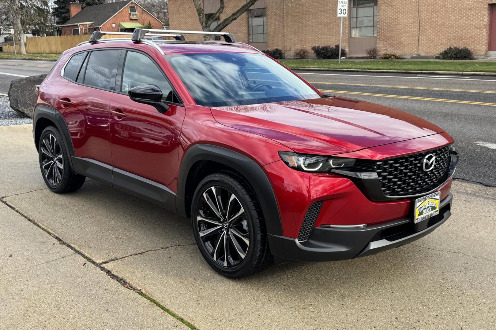 2023 Red Crystal Metallic /Black Mazda CX-50 Premium Plus (7MMVABEM3PN) with an 4 Cyl 2.5 Liter engine, Automatic 6 Speed transmission, located at 2304 W. Main St., Boise, ID, 83702, (208) 342-7777, 43.622105, -116.218658 - New Tires! Very Clean And Fun To Drive! - Photo#2