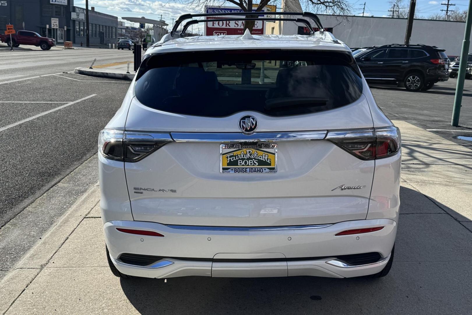 2022 White Frost Tintcoat /Chestnut/Ebony Buick Enclave Avenir (5GAEVCKW7NJ) with an V6 3.6 Liter engine, Automatic 9 Speed transmission, located at 2304 W. Main St., Boise, ID, 83702, (208) 342-7777, 43.622105, -116.218658 - Highly Optioned With Safety, Comfort And Power! - Photo#1